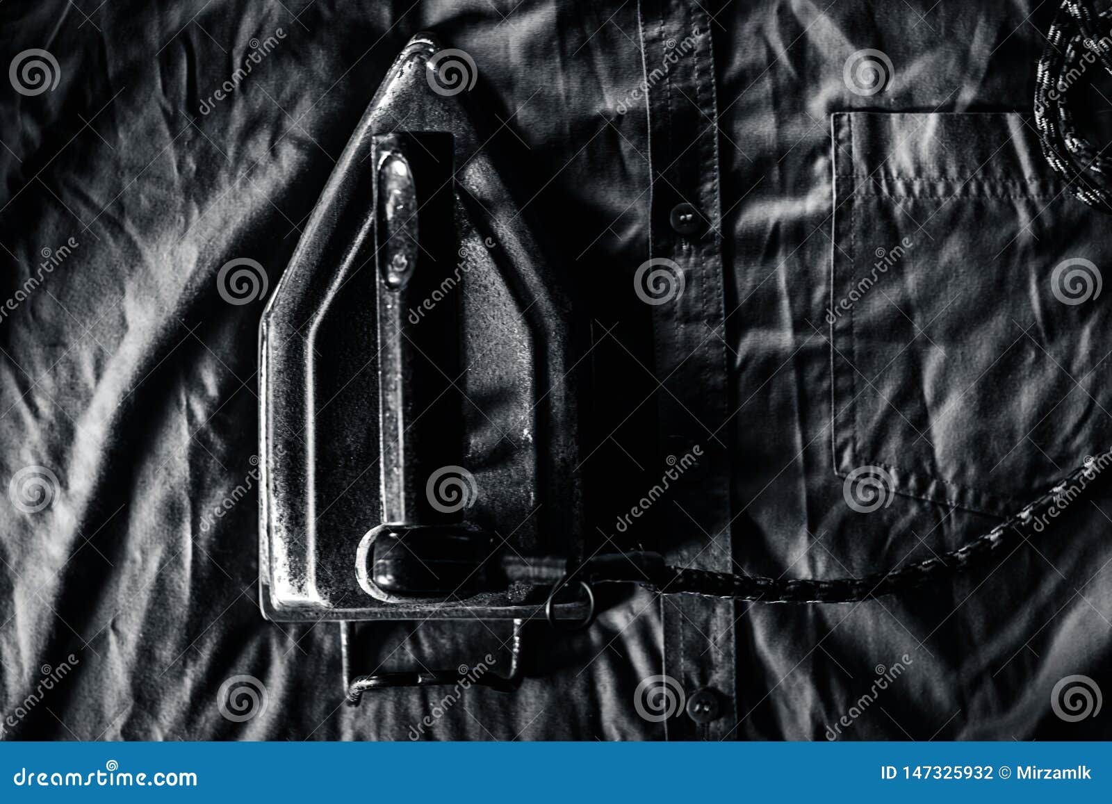 A Rusted Iron on a Blue Shiny Shirt. Stock Photo - Image of electric