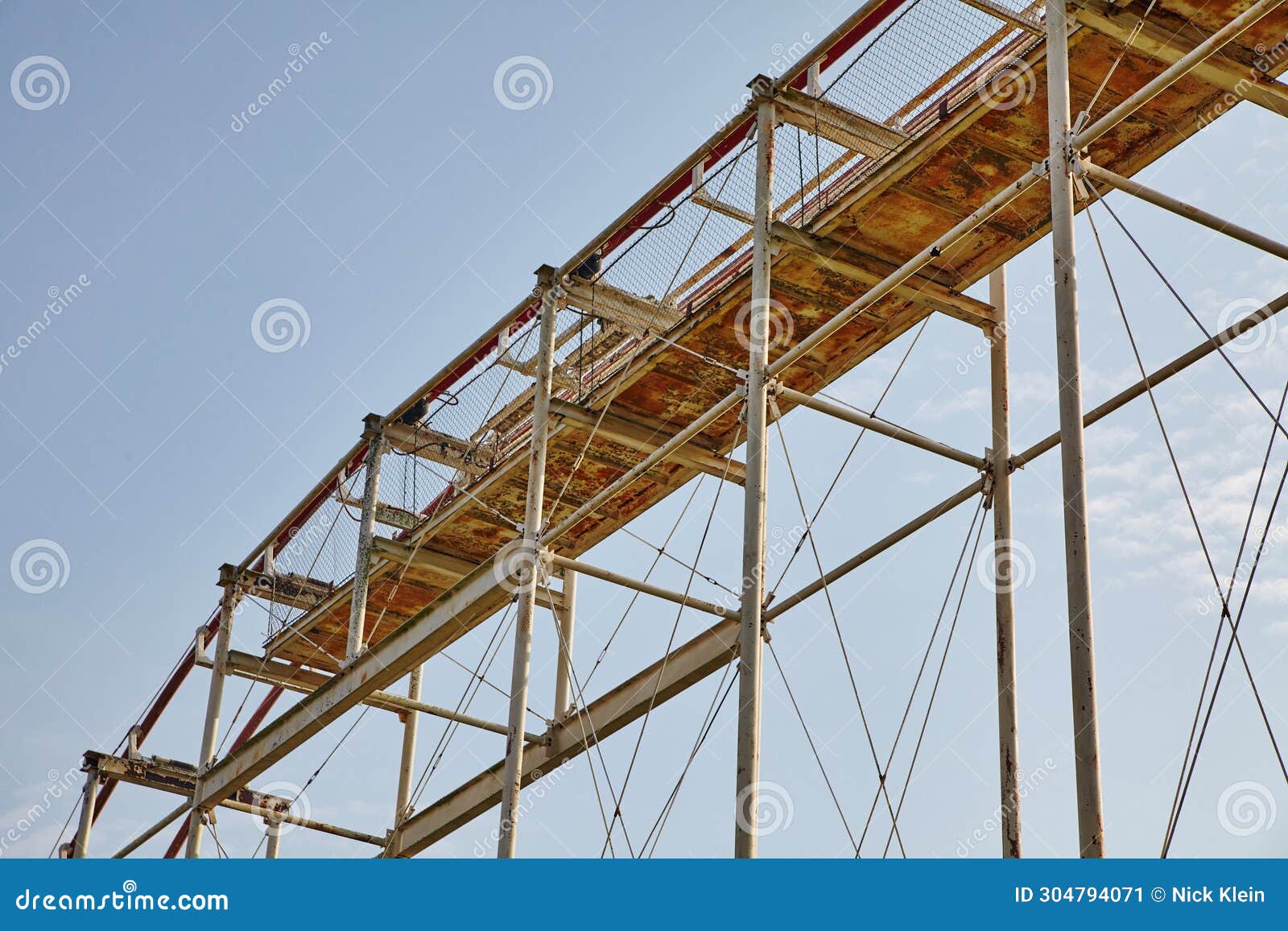 Rusted Roller Coaster Framework, Safety Netting, Blue Sky Perspective ...