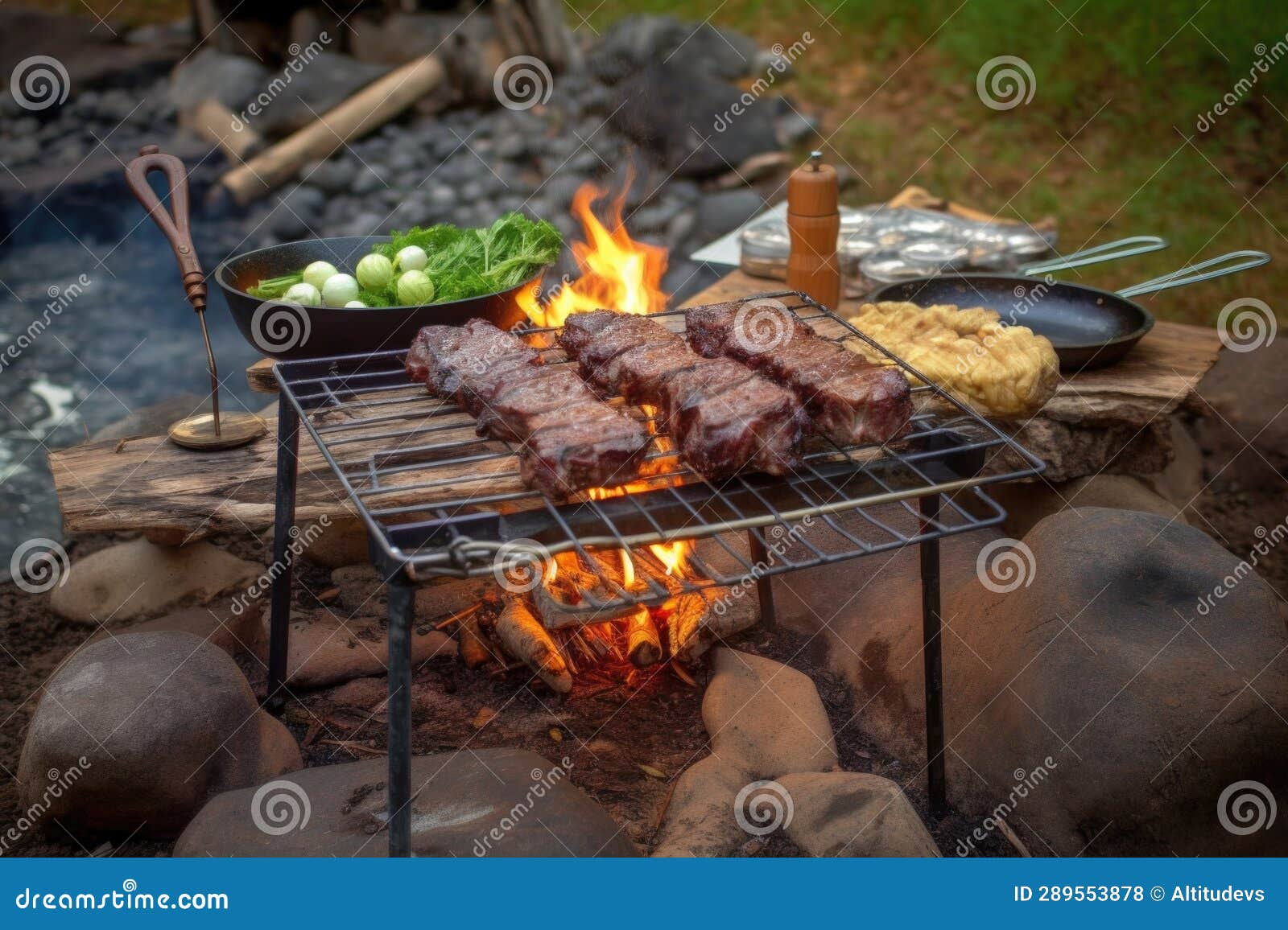 Rustic Campfire Grilling Setup with Lamb Chops and Veggies Stock