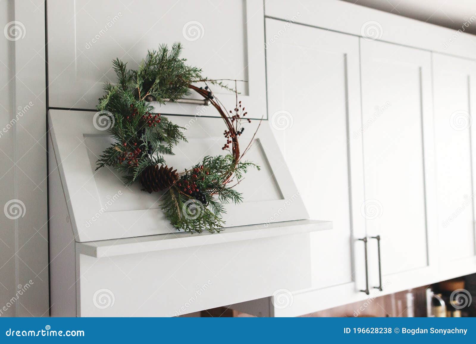 Rustic Christmas Wreath Hanging On Modern Kitchen Hood, Festive Holiday