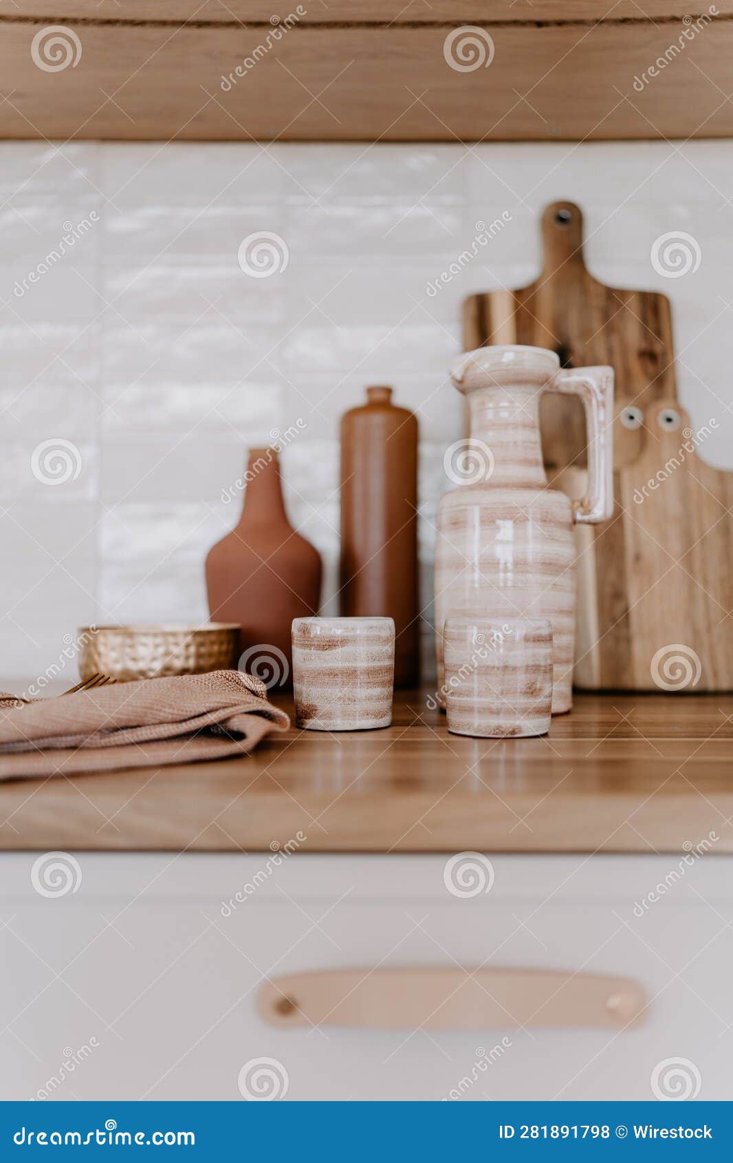Rustic Kitchen Countertop with a Selection of Ceramic Pots and Bowls on