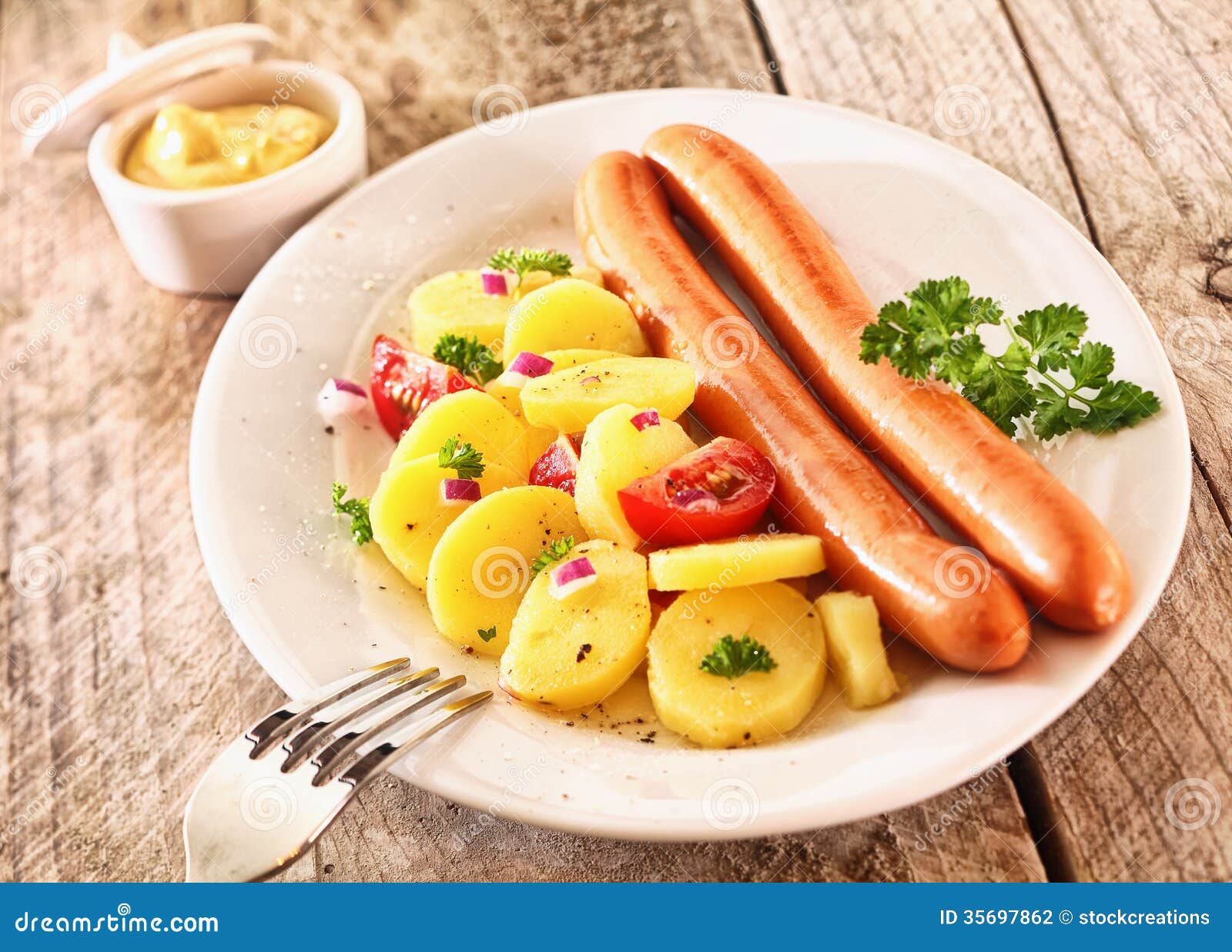 rustic lunch made of boiled potatoes and sausages