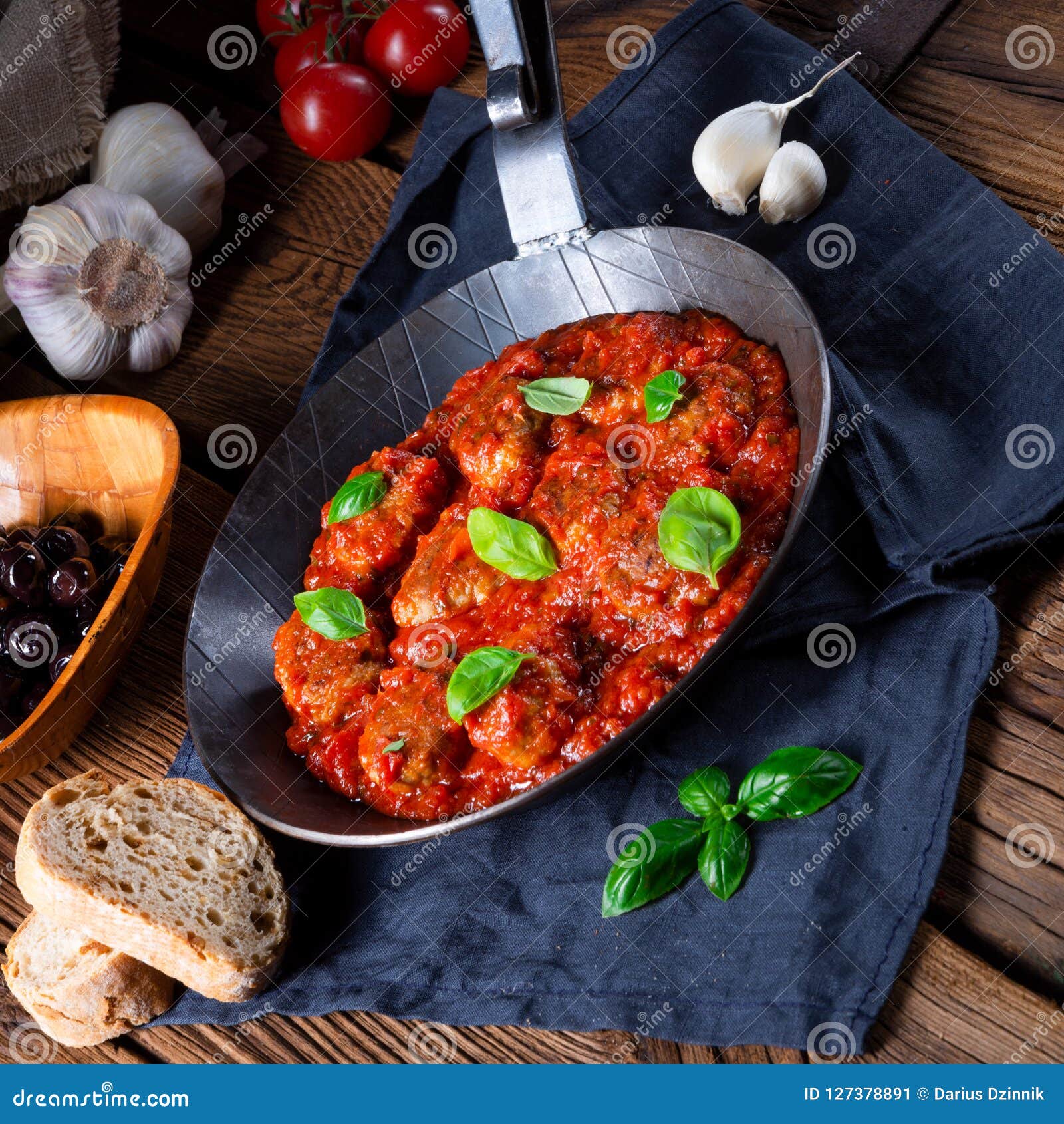 A Rustic Mini Meatballs Baked in Tomato Sauce with Basil Stock Image