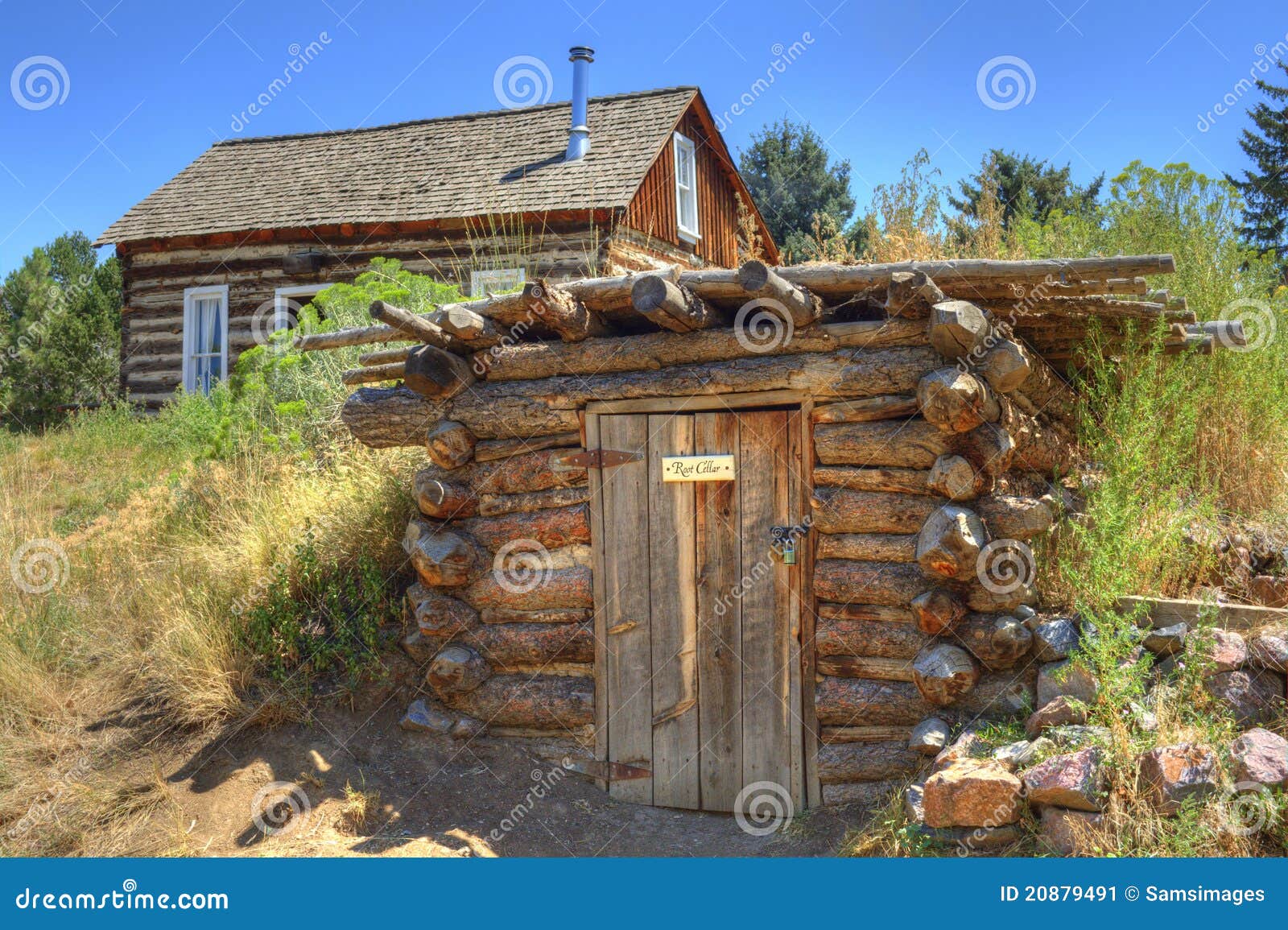 rustic old time log cabin and root cellar