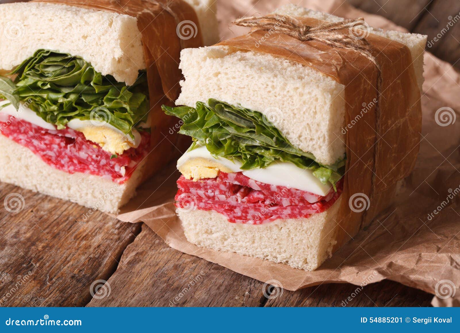 Rustic Sandwiches with Salami, Lettuce and Eggs Horizontal Stock Image