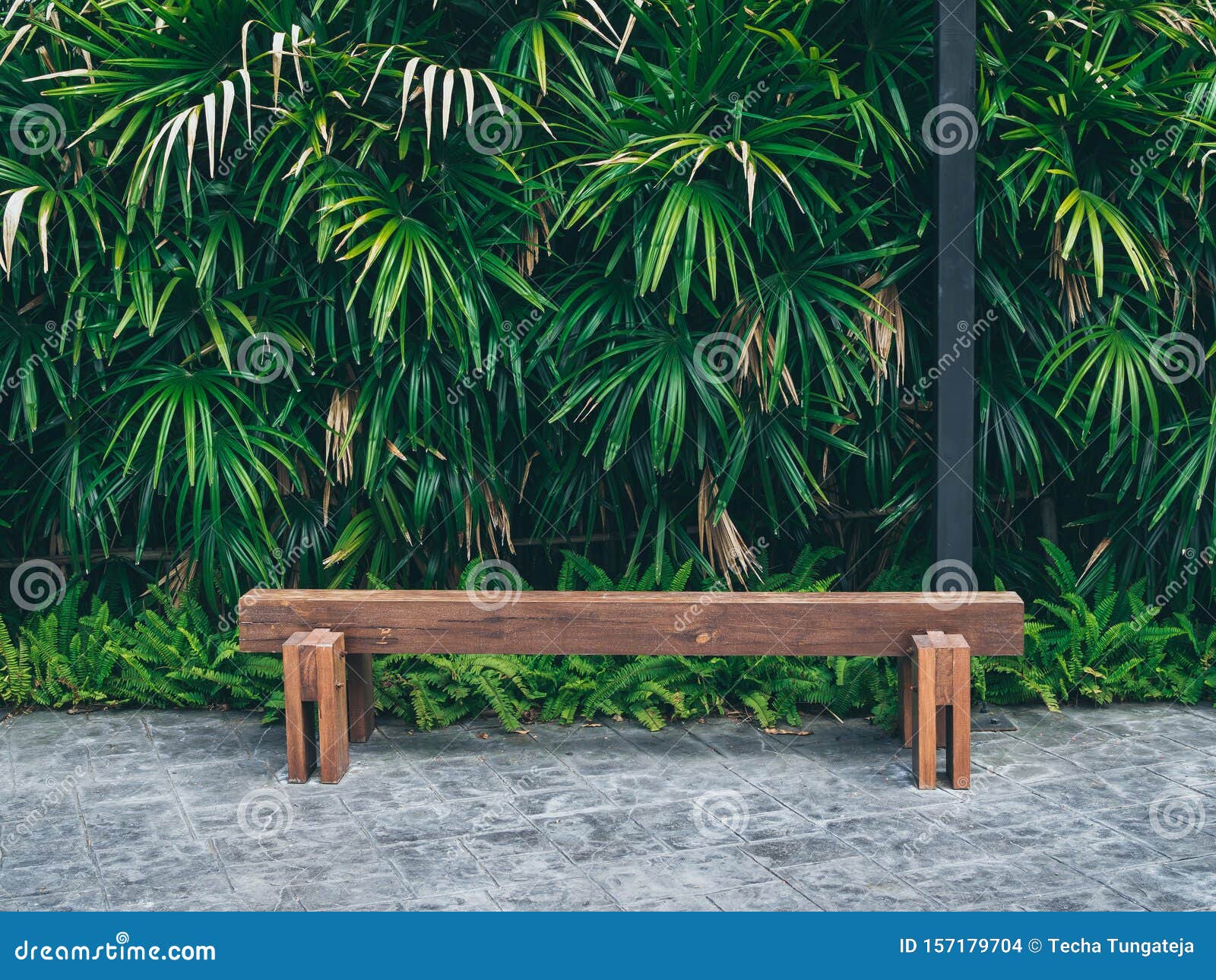 Rustic Solid Railway Sleeper Wooden Bench On Concrete Floor Stock
