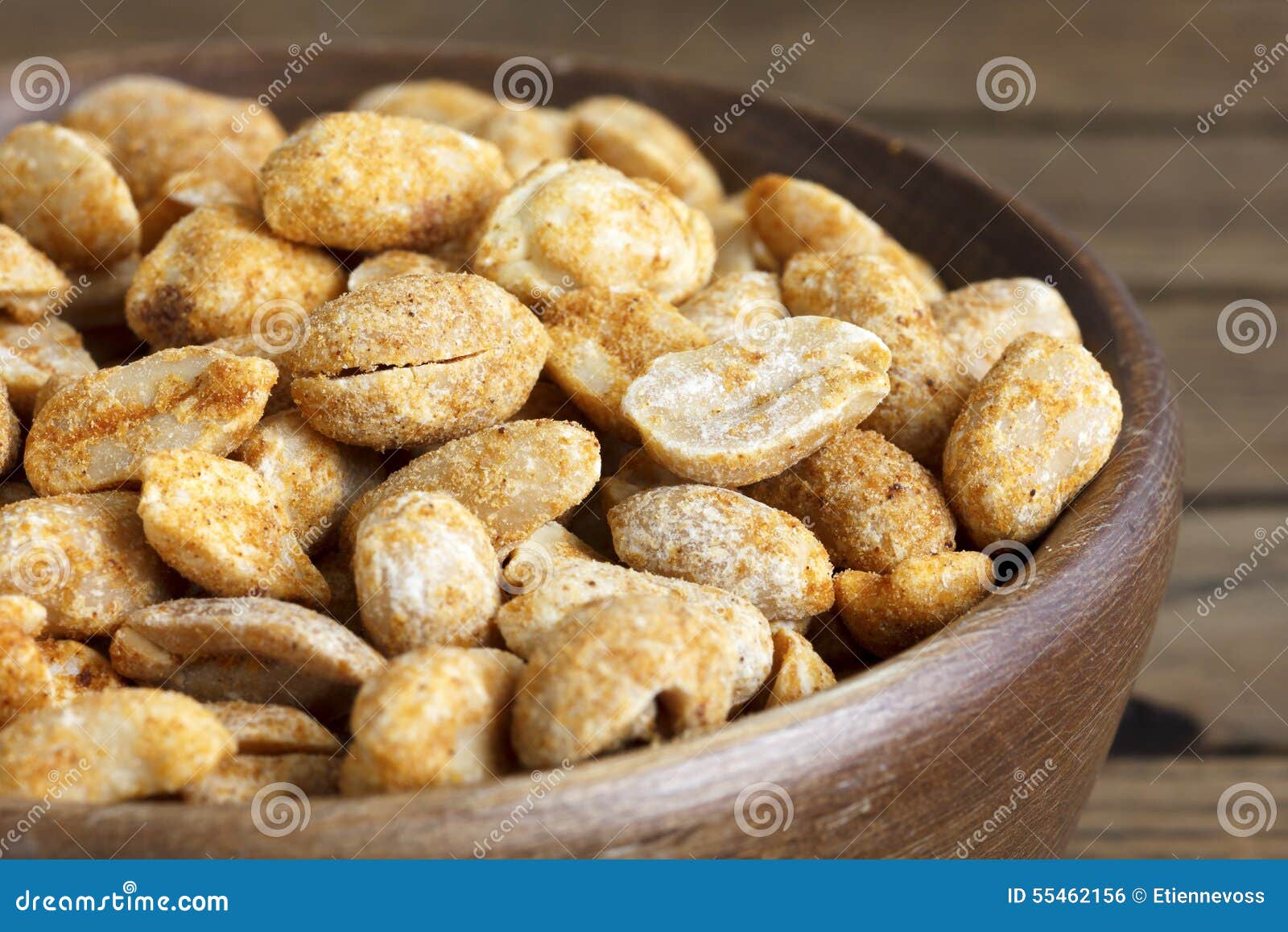Rustic Spicy Dry Roasted Peanuts in Rustic Wood Bowl. Stock Photo