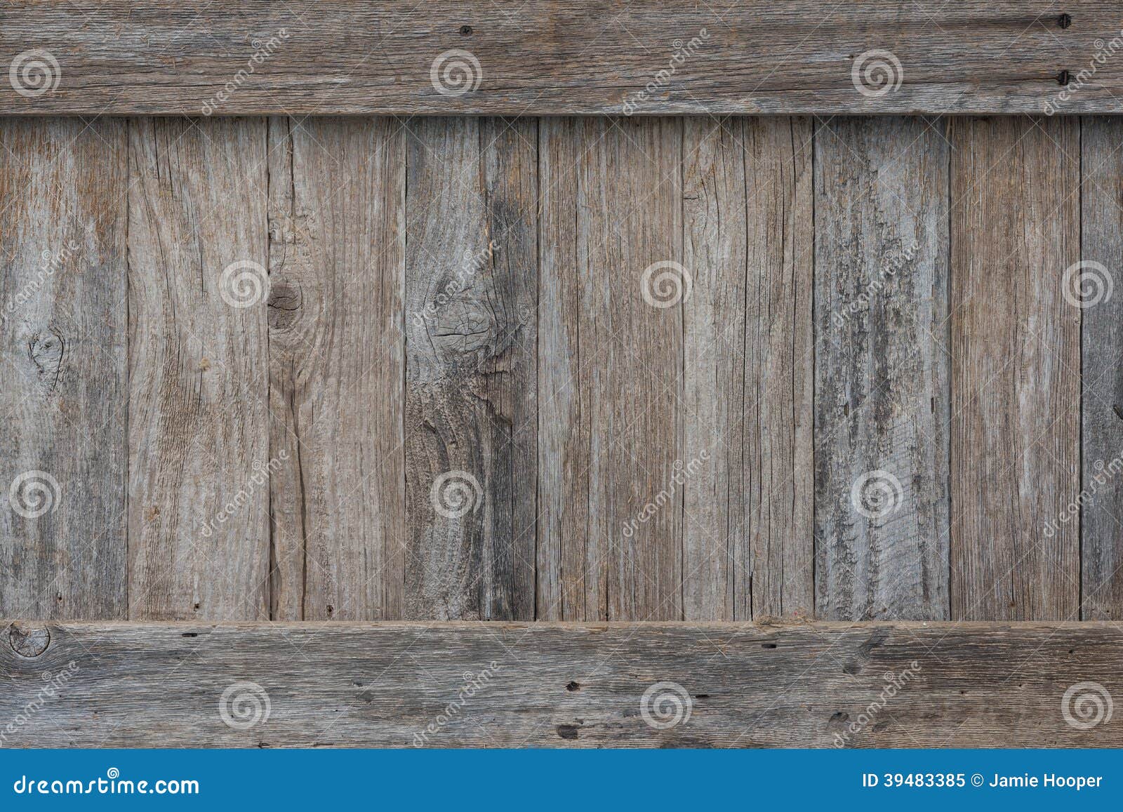 Weathered boards on the side of an old wooden crate or box with border 