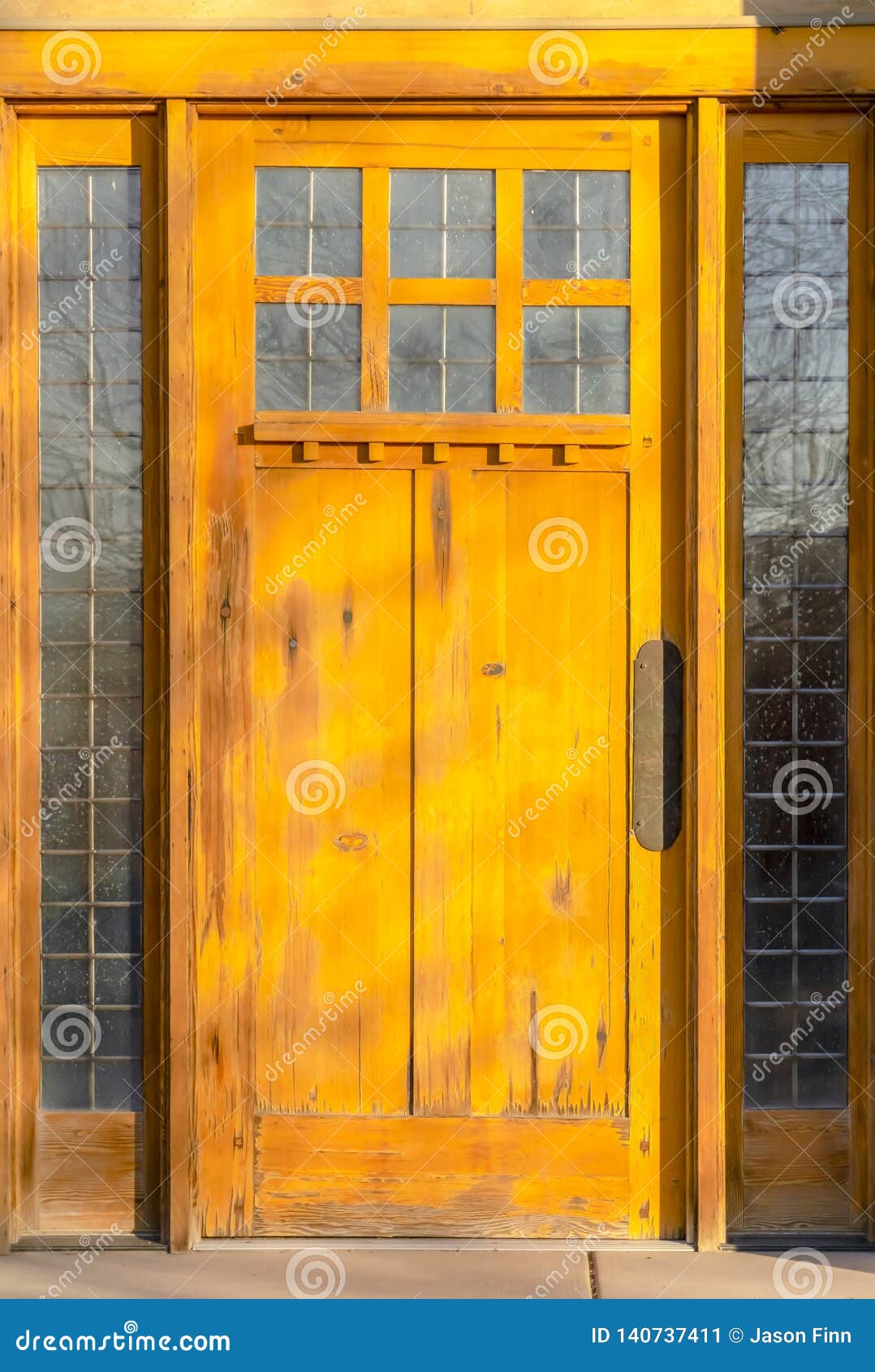 Rustic Wooden Door With Reflective Glass Panels Stock Image