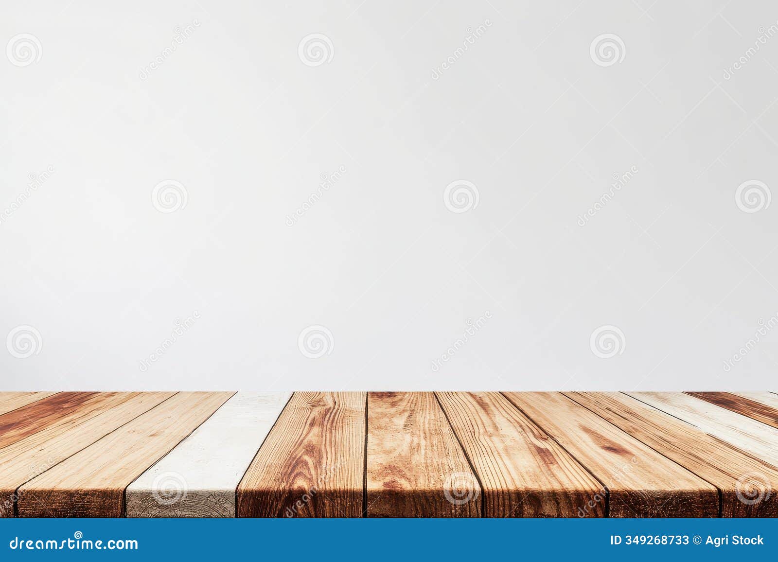 rustic wooden tabletop against a white wall