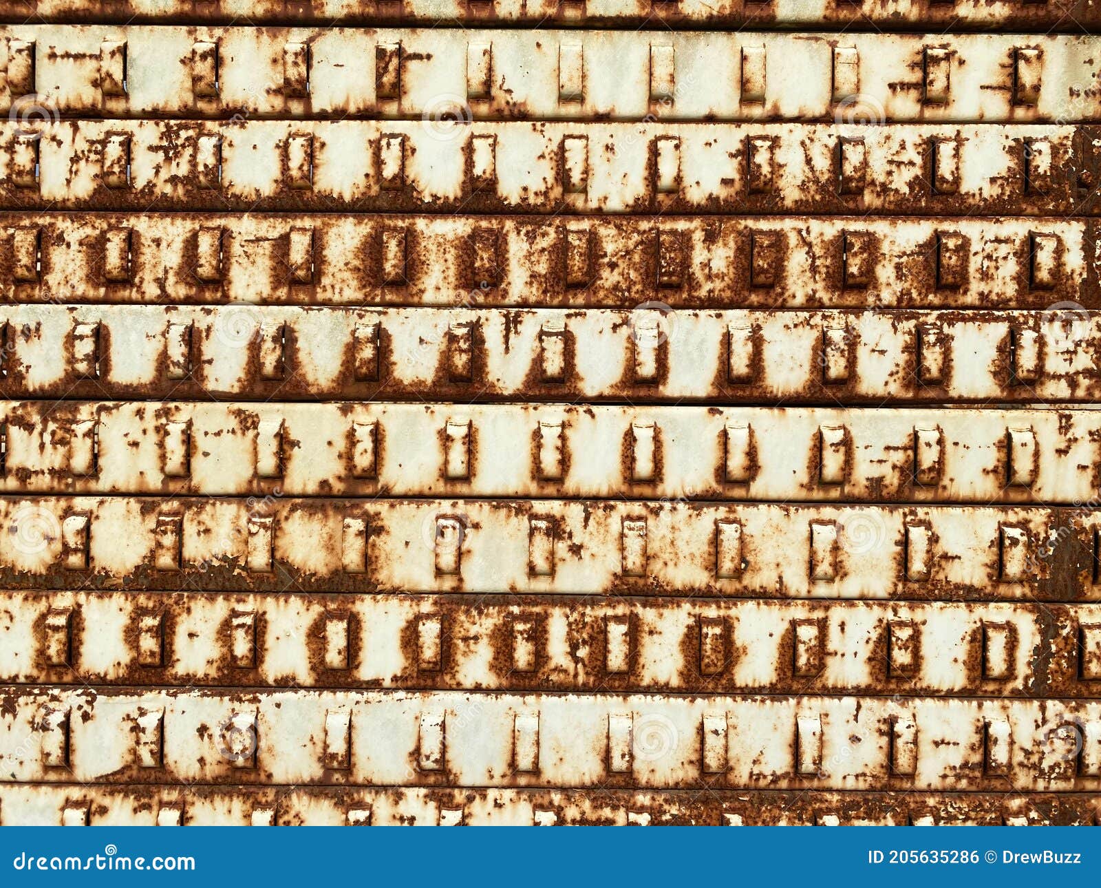 Rusting Old Rack Slat Wall Hanging System Left Out in the Rain To Rust