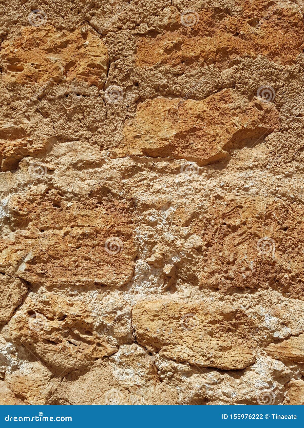 rusty brown mustard stone wall