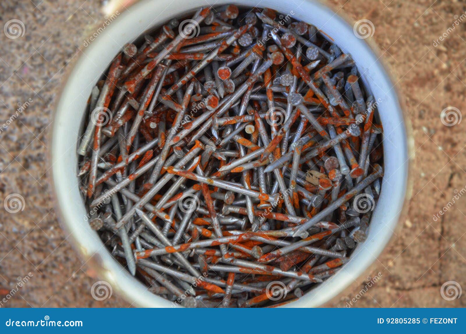 Rusty nails in tin stock image. Image of detail, white 92805285