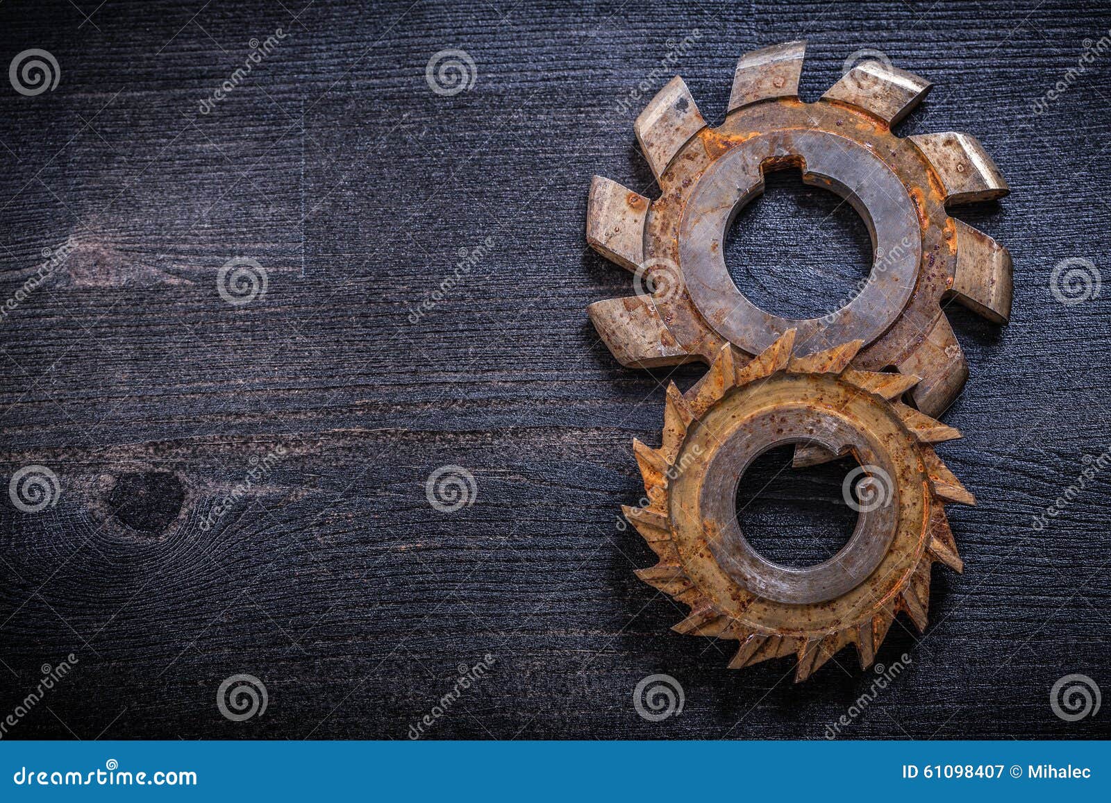 Rusty Obsolete Rotary Cutters on Wooden Surface Construction Con Stock