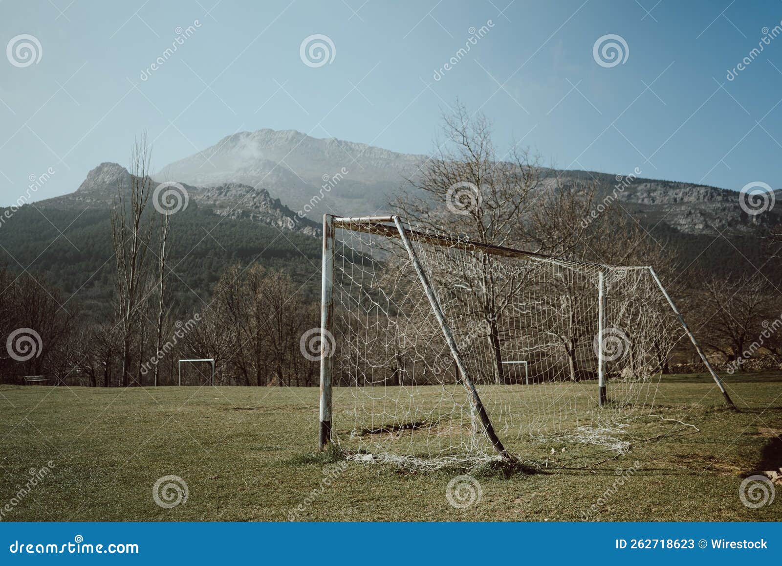 rusty soccer goal post in an abandoned old field near majaelrayo, spain