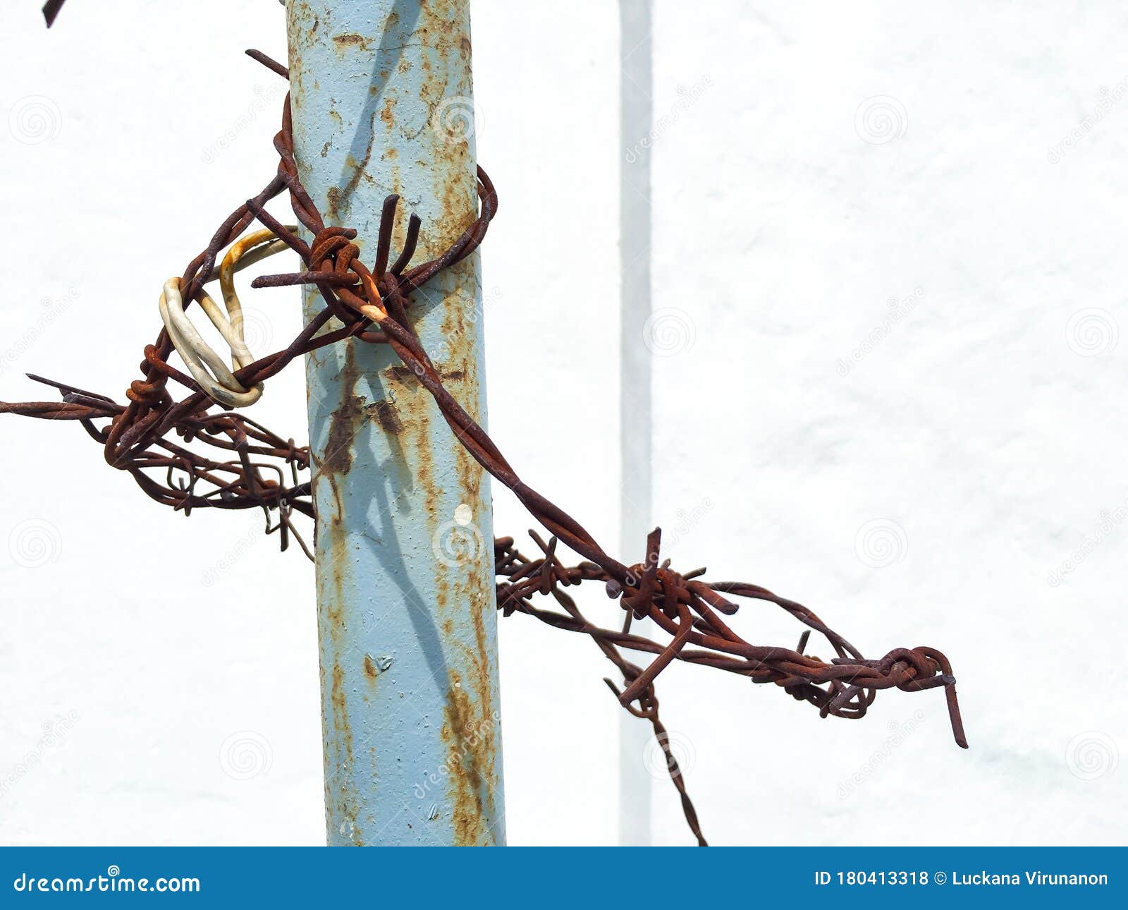 Rusty Wires Texture Hold on Pillar in White Background Stock Photo