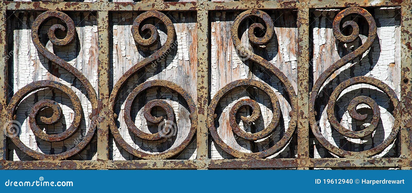 rusty wrought iron fence detail