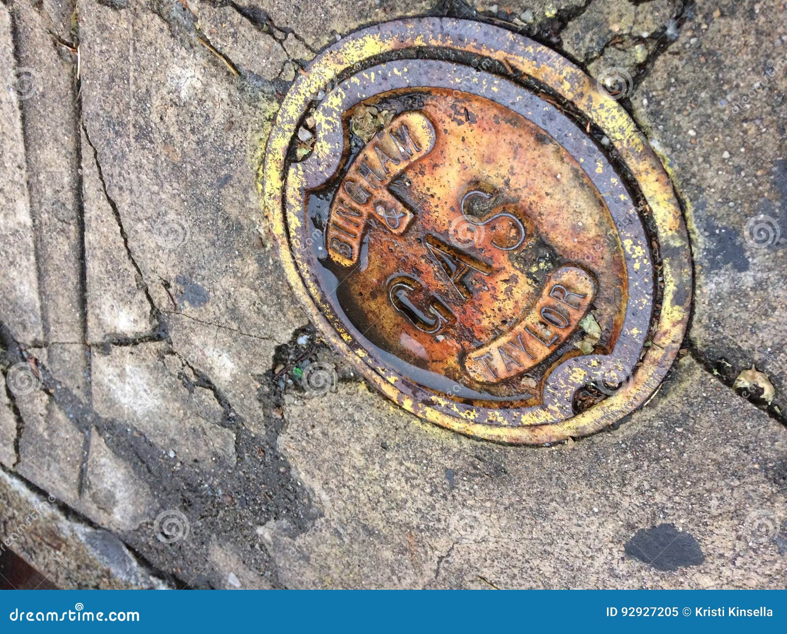 Rusty Yellow Gas Cap on the Concrete Ground Sidewalk with Cracks Stock