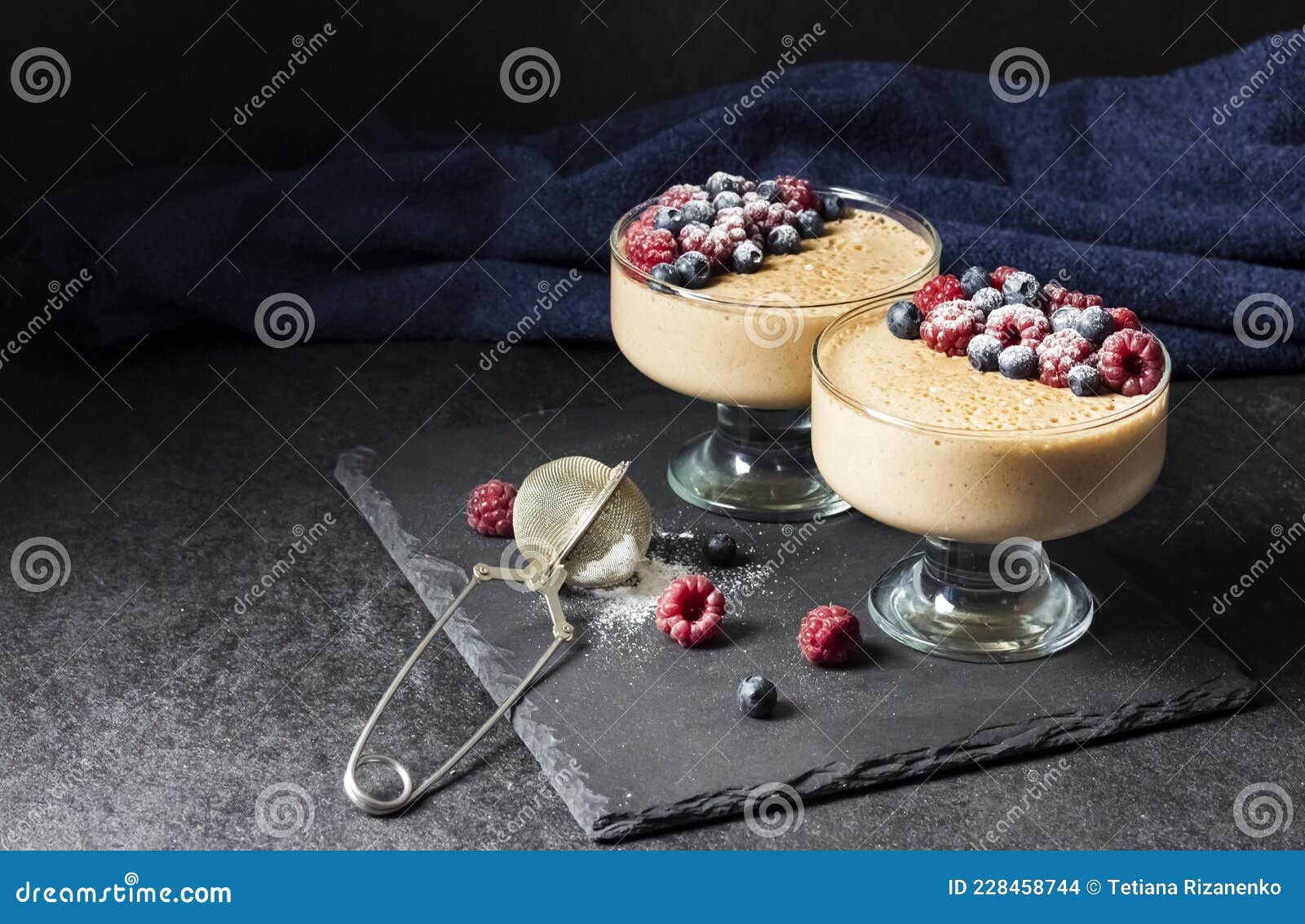 ryazhenka mousse in glass bowls decorated with fresh berries