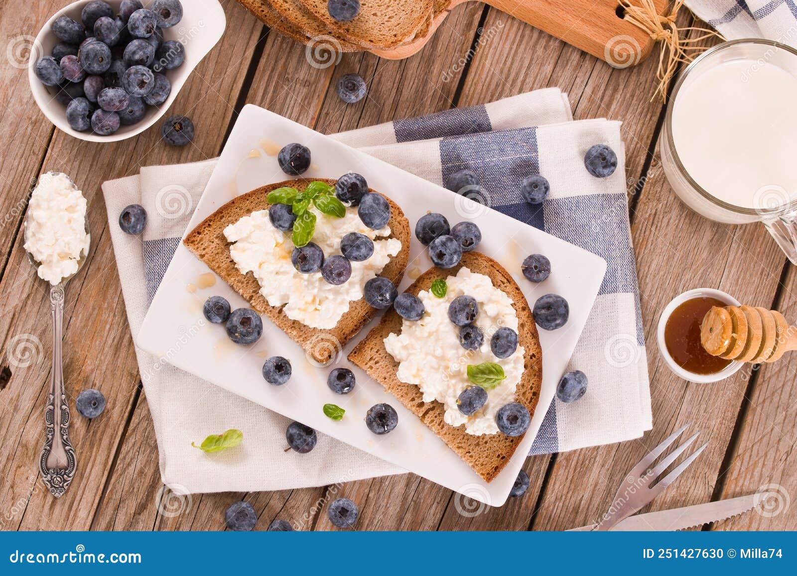 Rye Bread with Cottage Cheese, Blueberries and Honey. Stock Photo