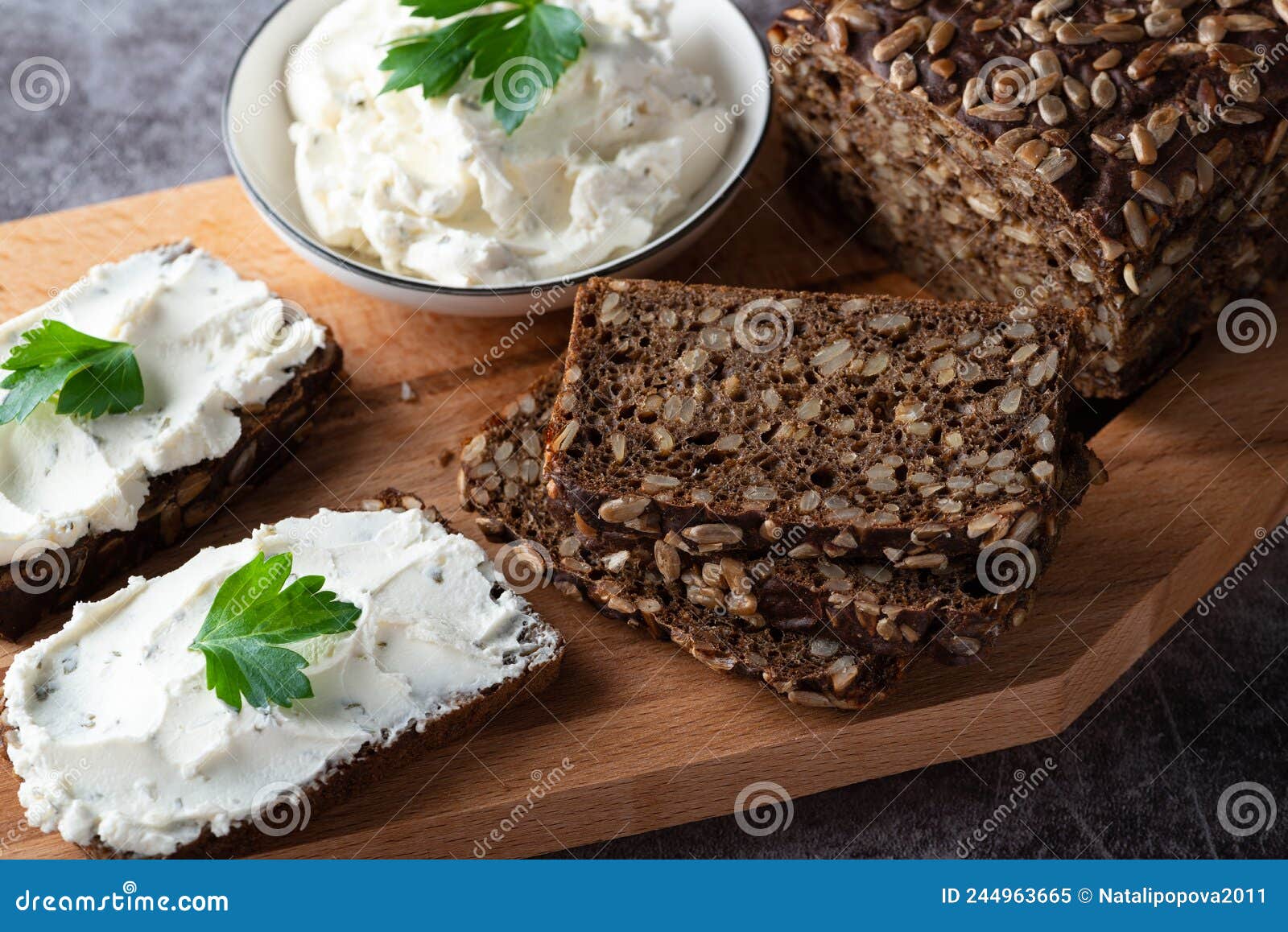 Rye Bread with Cream Cheese on Grey Table. Whole Grain Rye Bread with