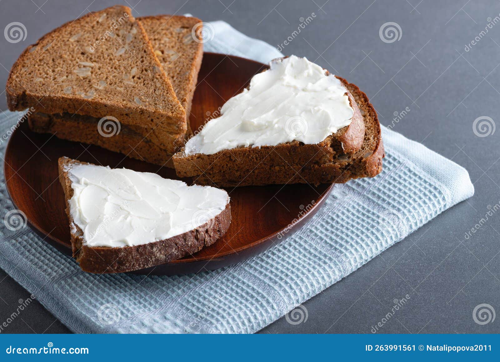 Rye Bread with Cream Cheese on Wood Plate, Rustic Food Stock Image