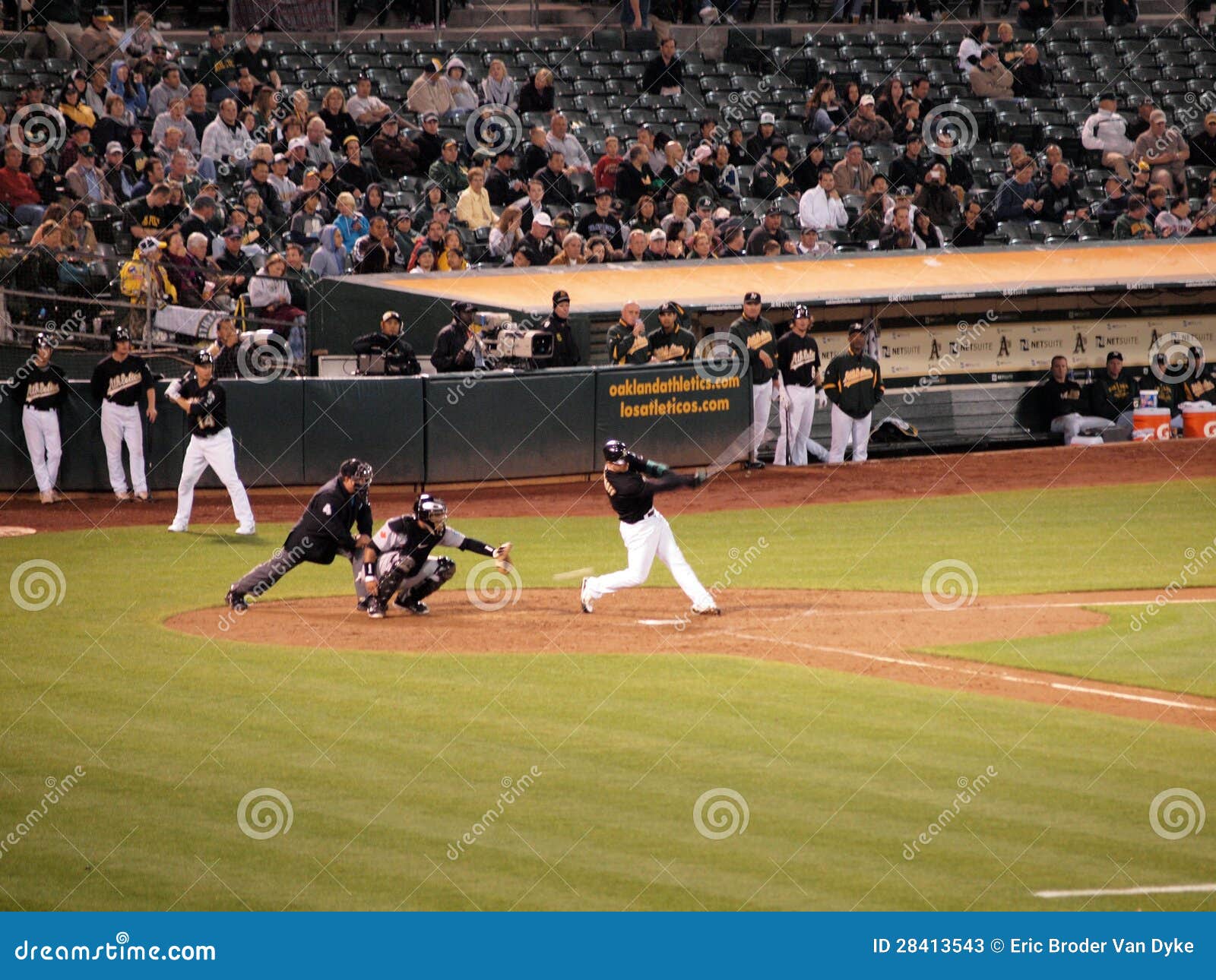 A s Batter swings and misses pitch. OAKLAND, CA - AUGUST 18: Blue Jays vs. Athletics: A s Batter Kevin Kouzmanoff swings and misses pitch at incoming pitch.. August 18 2010 at Coliseum in Oakland California.