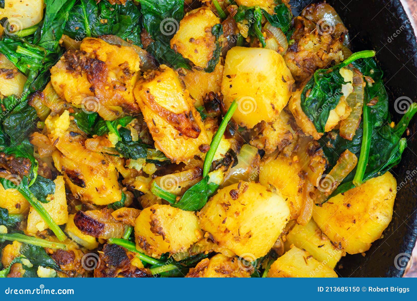 Saag Aloo, Indian Style Spinach and Potatoes in Cast Iron Pan Stock