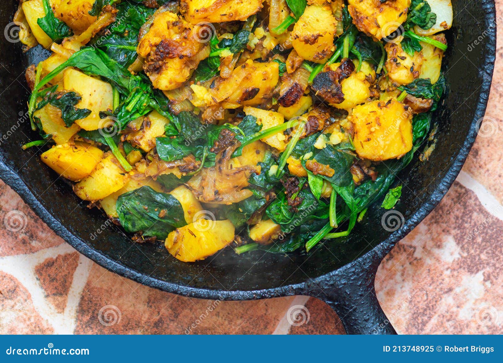 Saag Aloo, Indian Style Spinach and Potatoes in Cast Iron Pan Stock