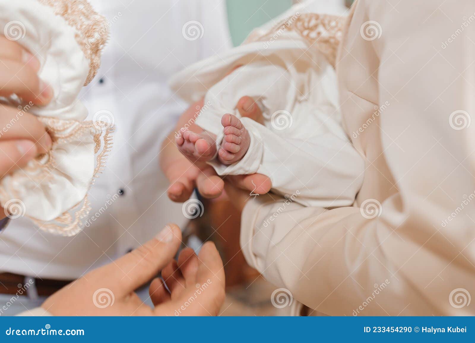 sacrament of baptism the priest baptizes the child with the anointing