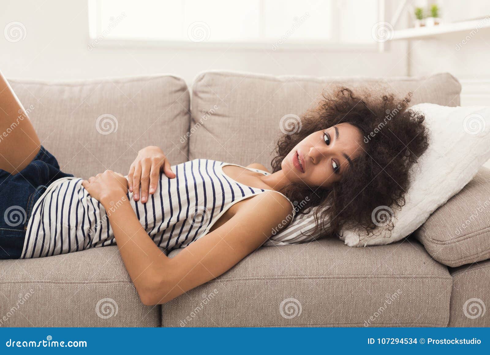 Sad African American Woman On Couch At Home Stock Photo Image Of