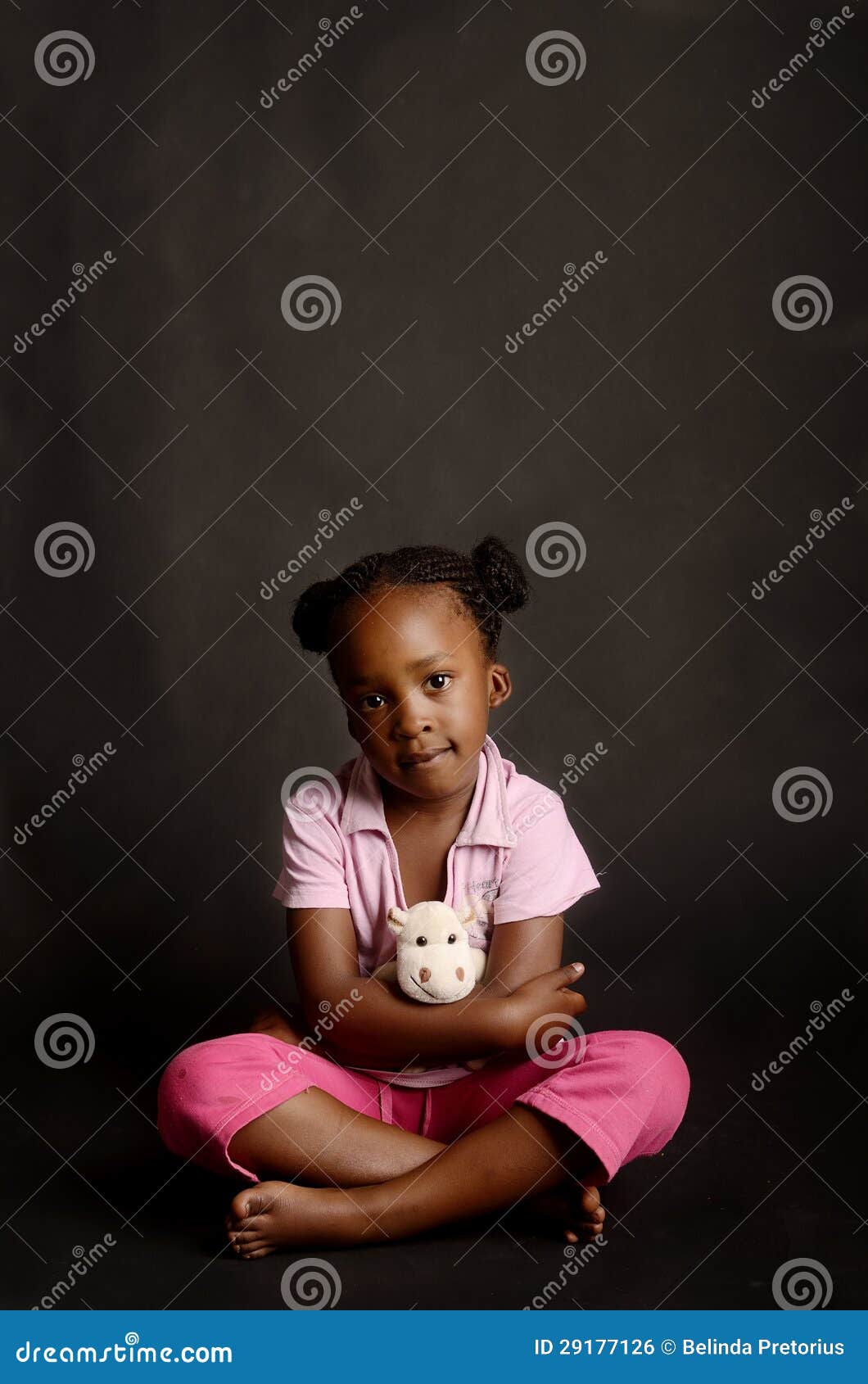 sad little girl sitting alone