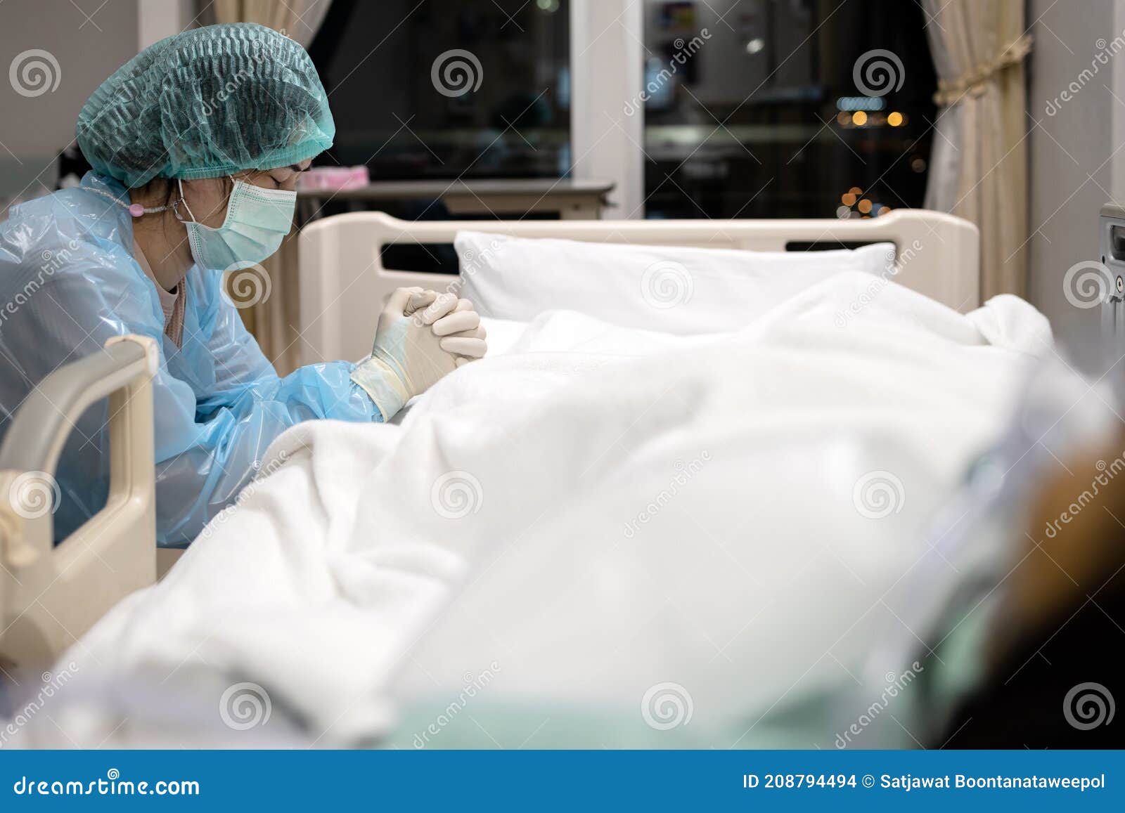 sad asian woman or nurse in face mask and medical uniform pray with closed eyes hands clasped together say a prayer for senior