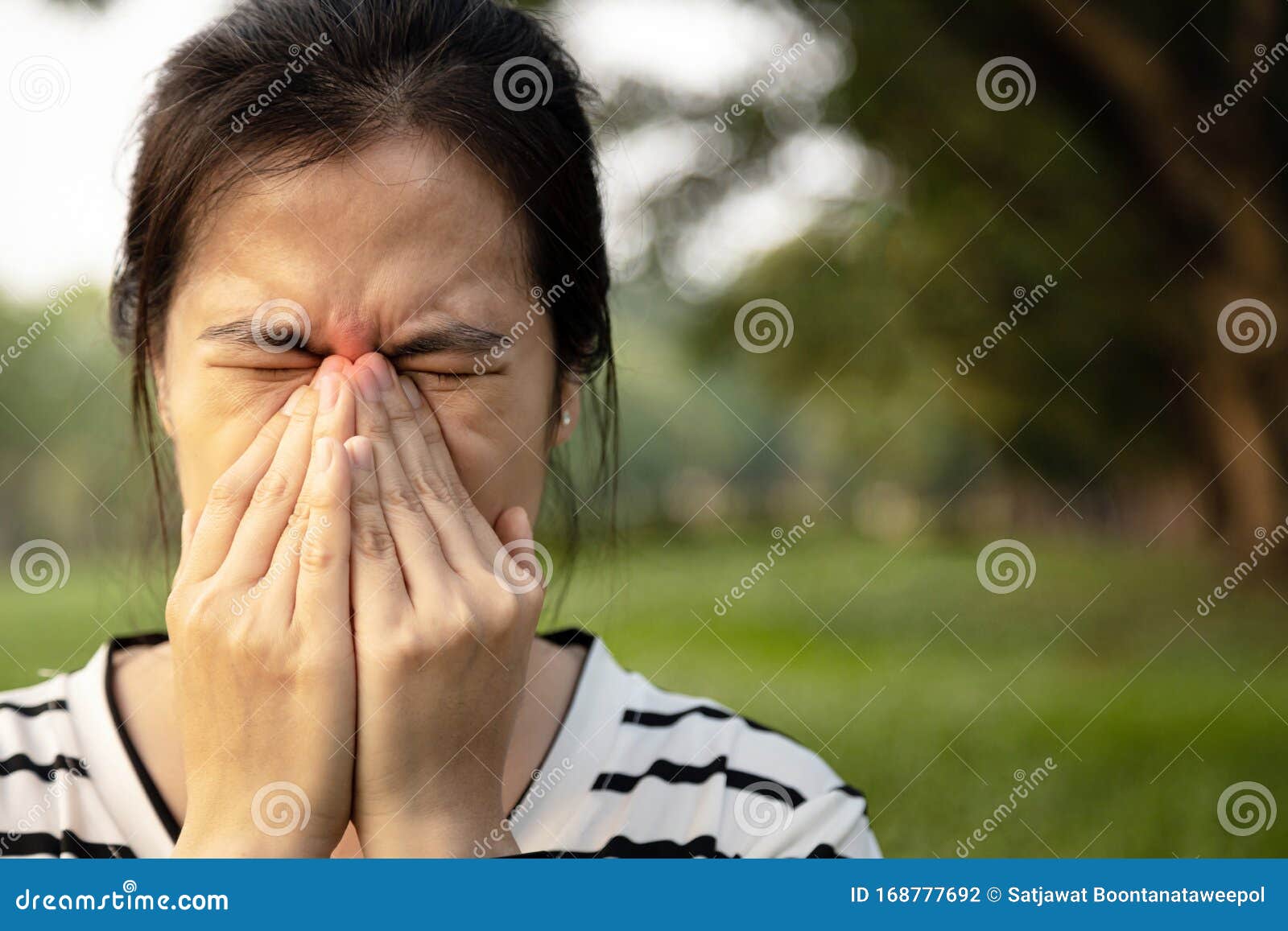 sad asian young woman holding her nose with closed eyes while paranasal sinus pain,sinusitis symptoms or dust allergies, unhealthy