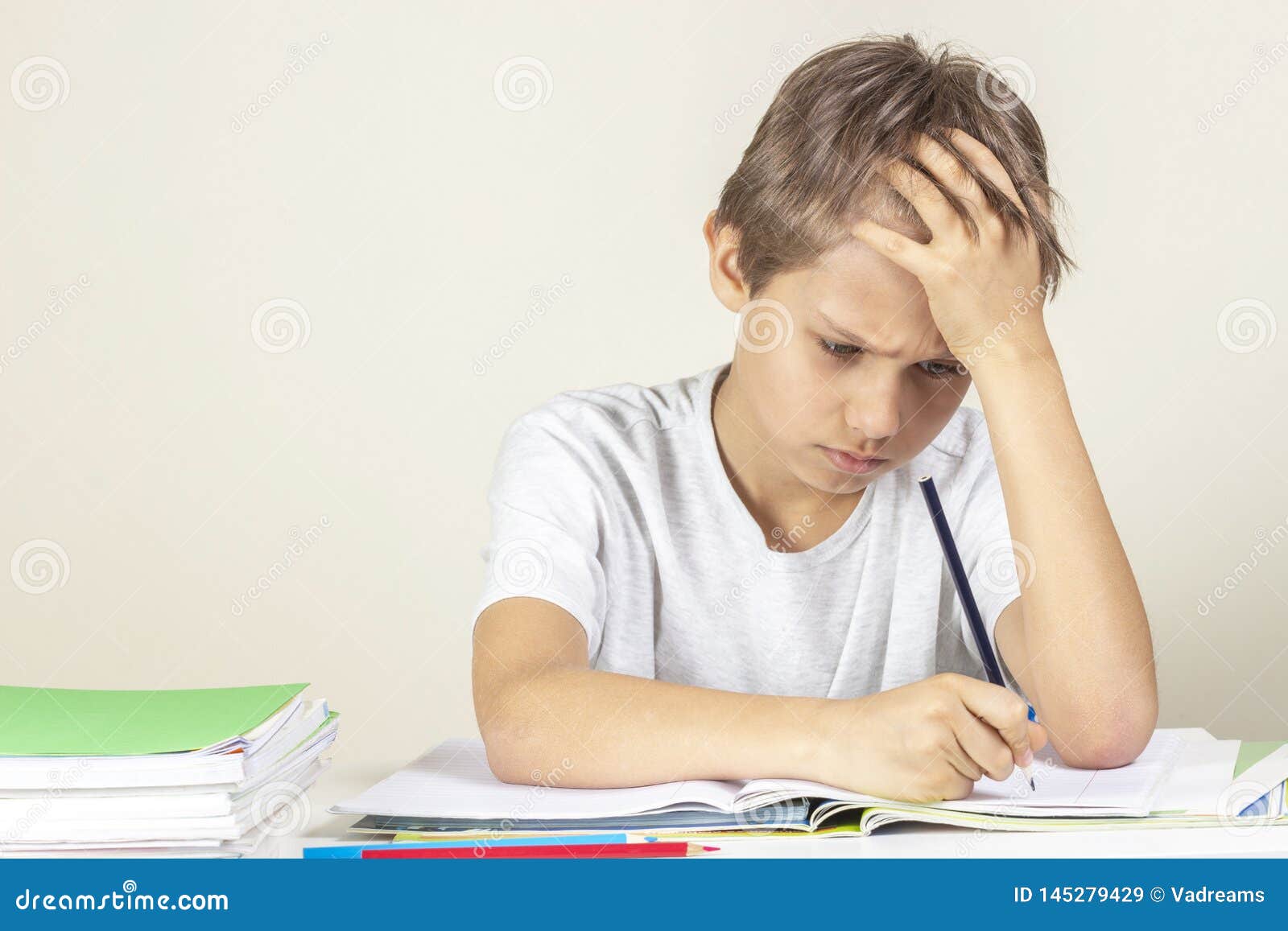 kid doing homework sad