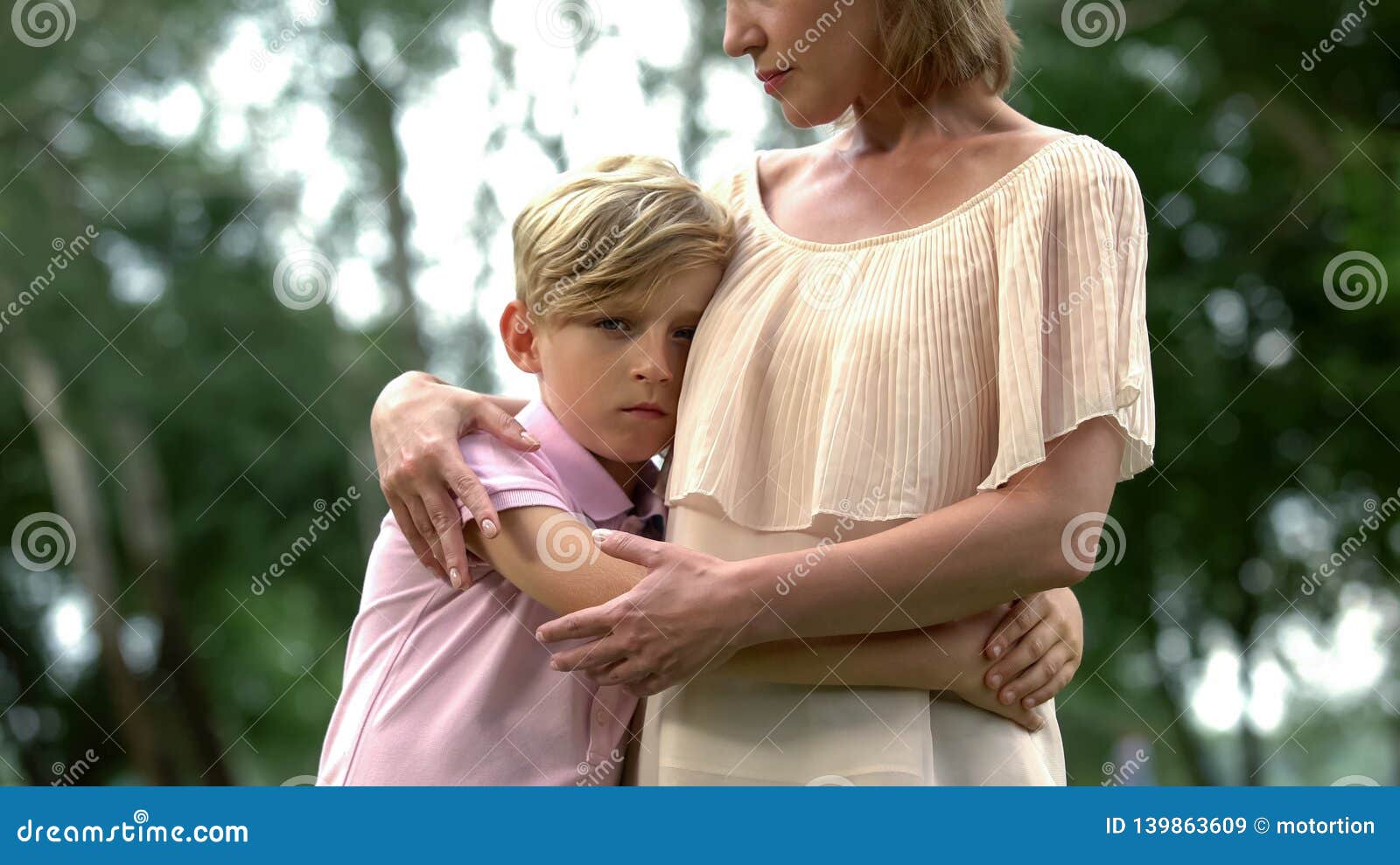 sad boy hugging mother, bereavement of family member, psychological trauma