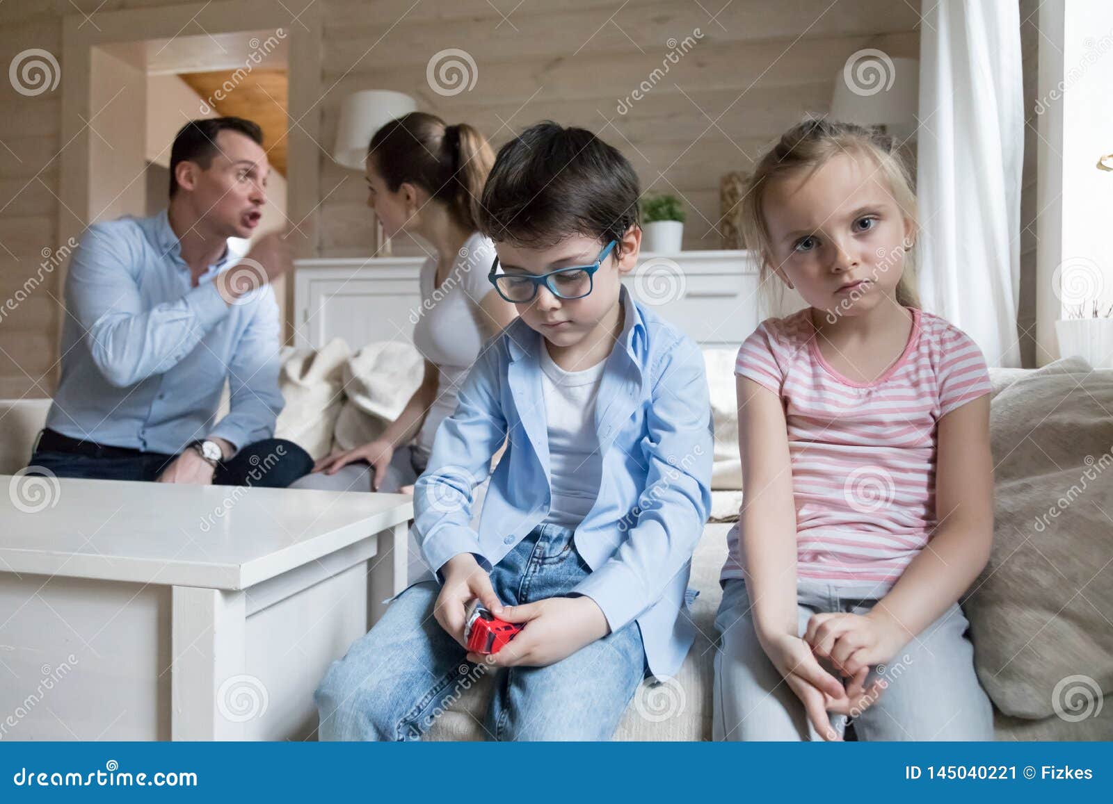sad children listen parents have angry fight at home headshot