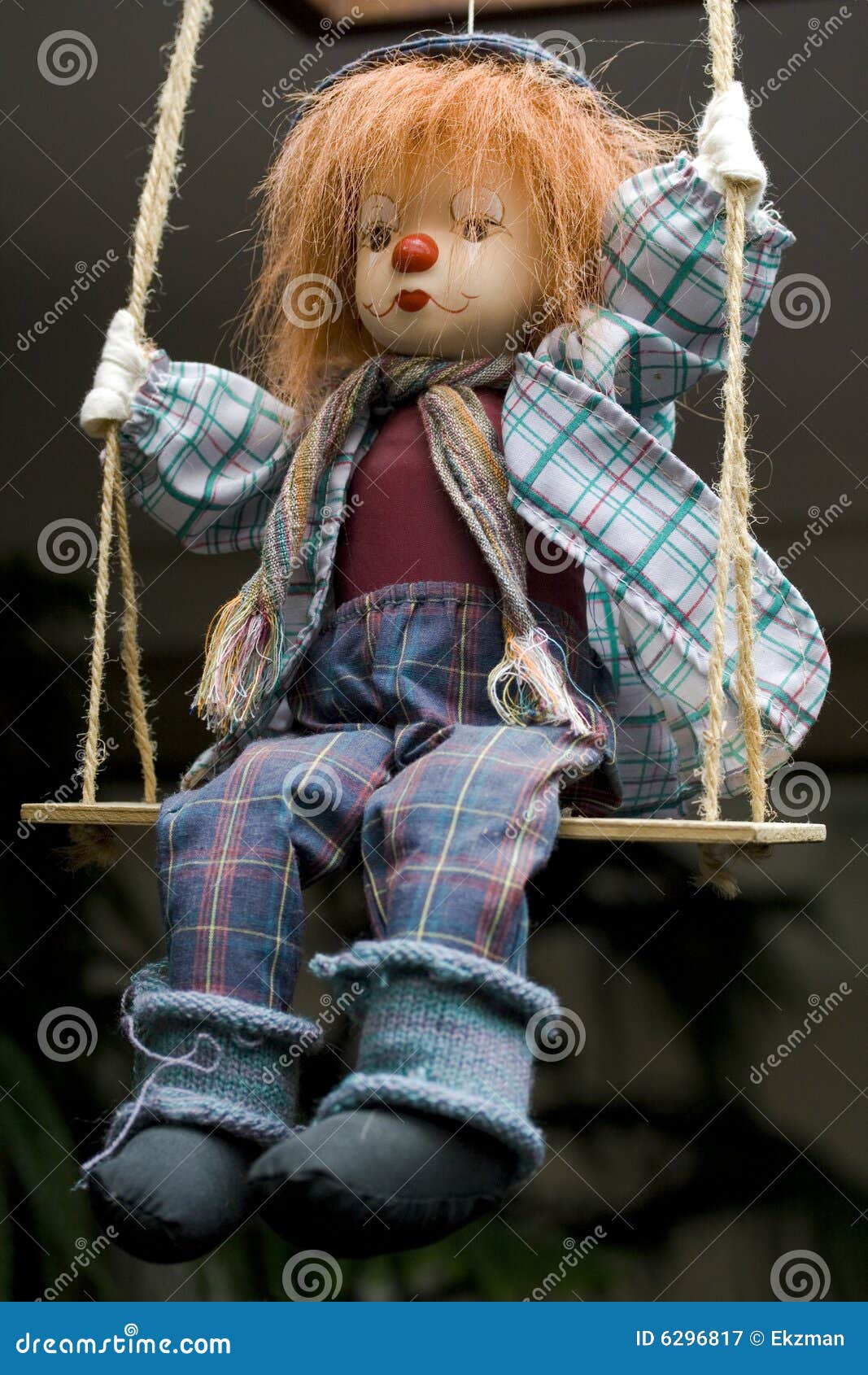 sad clown on swings royalty free stock photography image expressions photography and design
