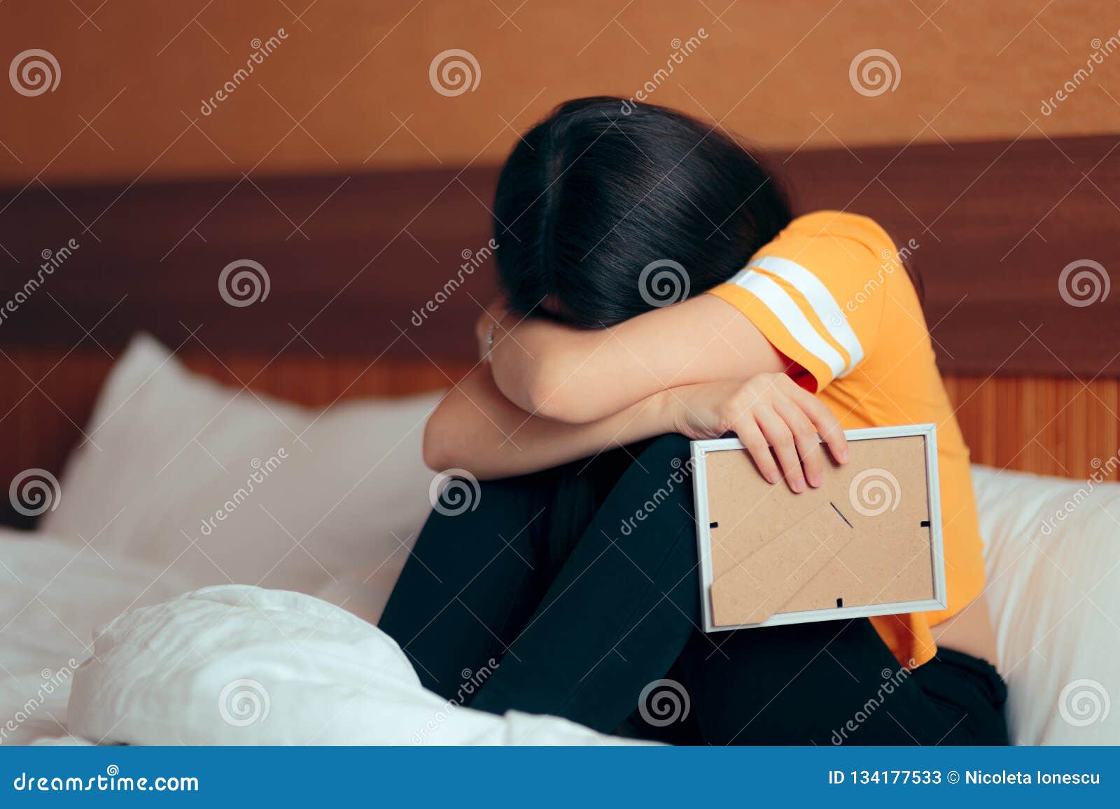 Sad Depressed Girl Crying after Break-up Holding Framed Picture ...