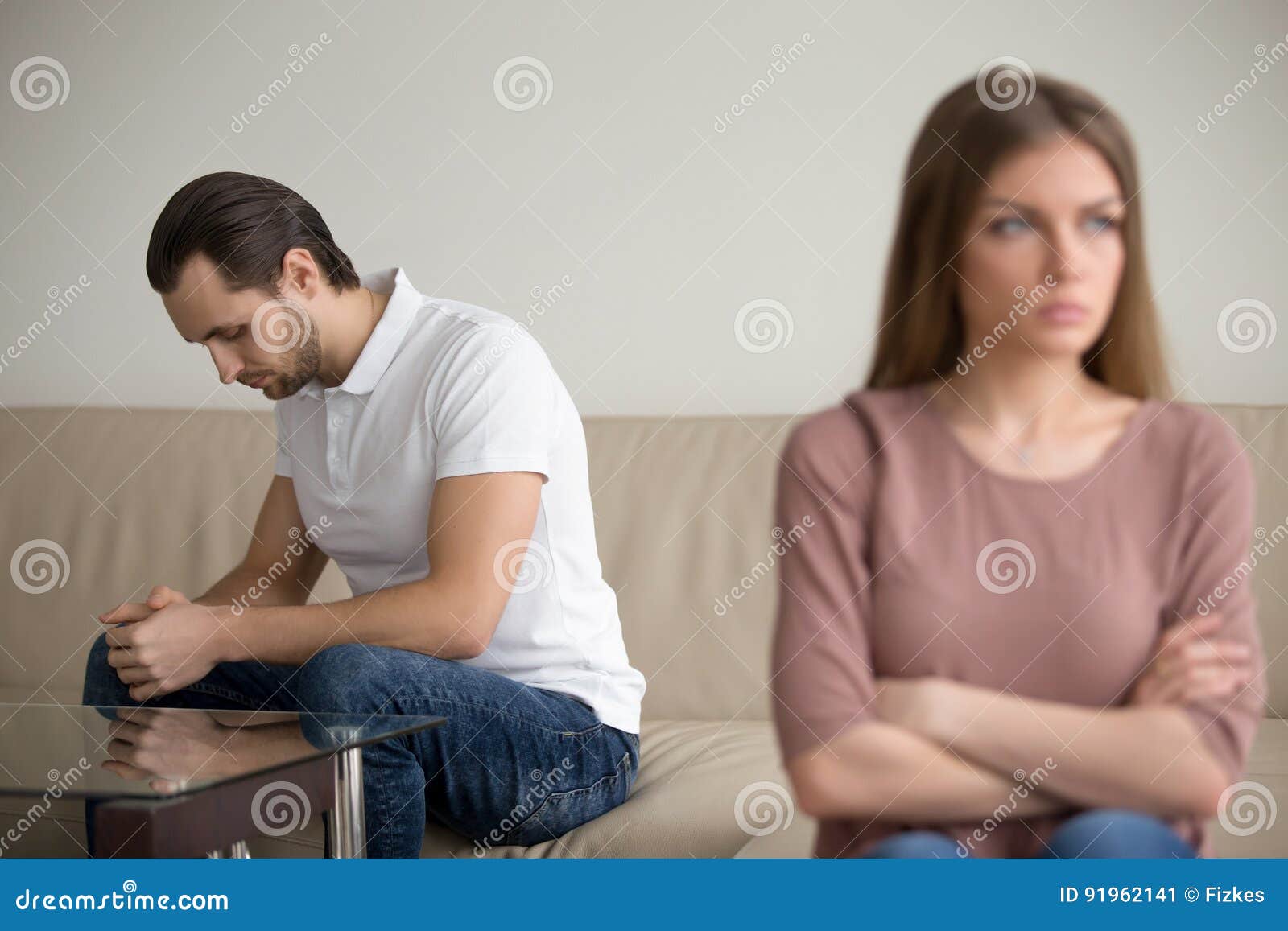 sad husband watches wife