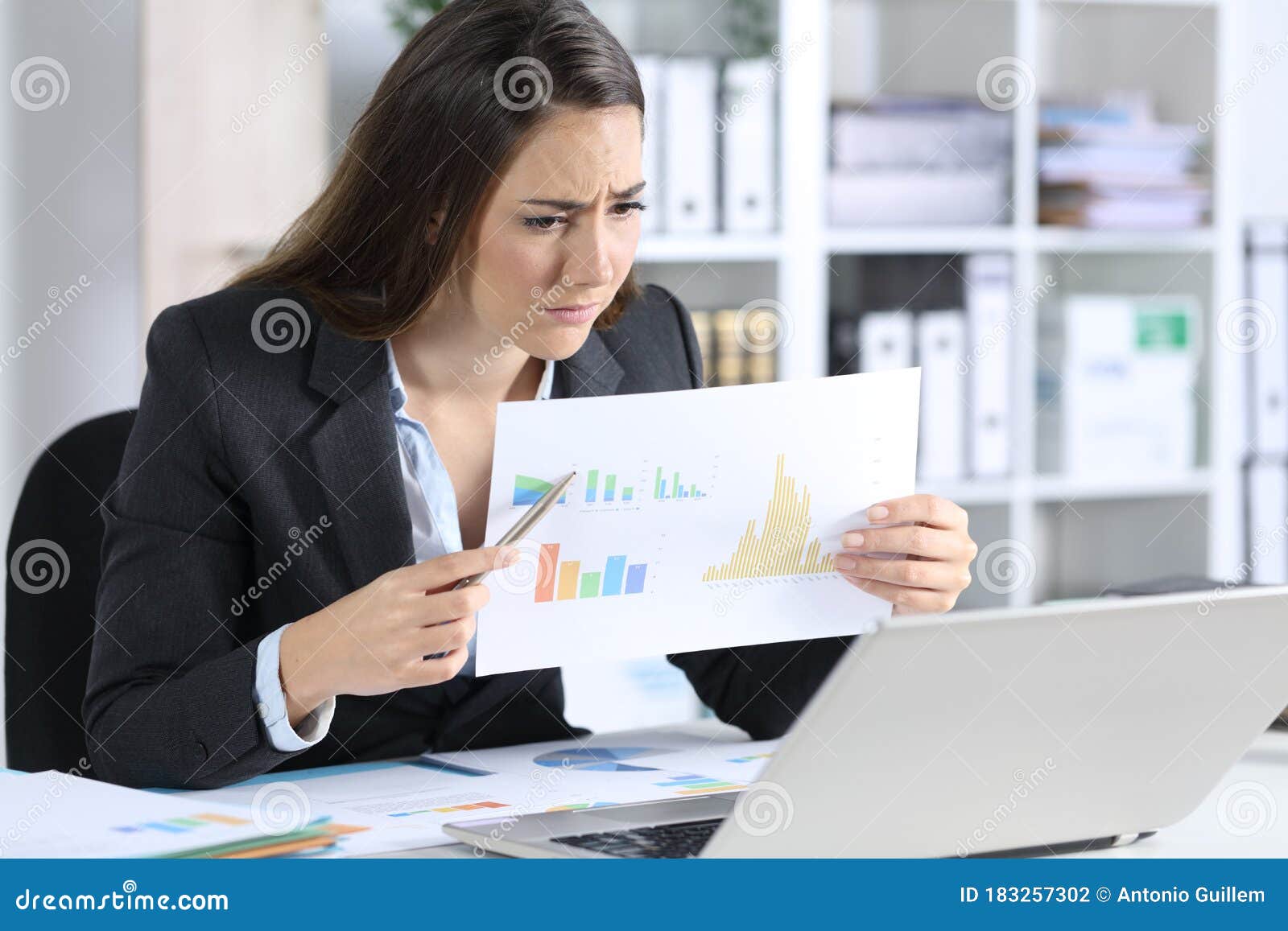 sad executive showing bad results report on videocall at office