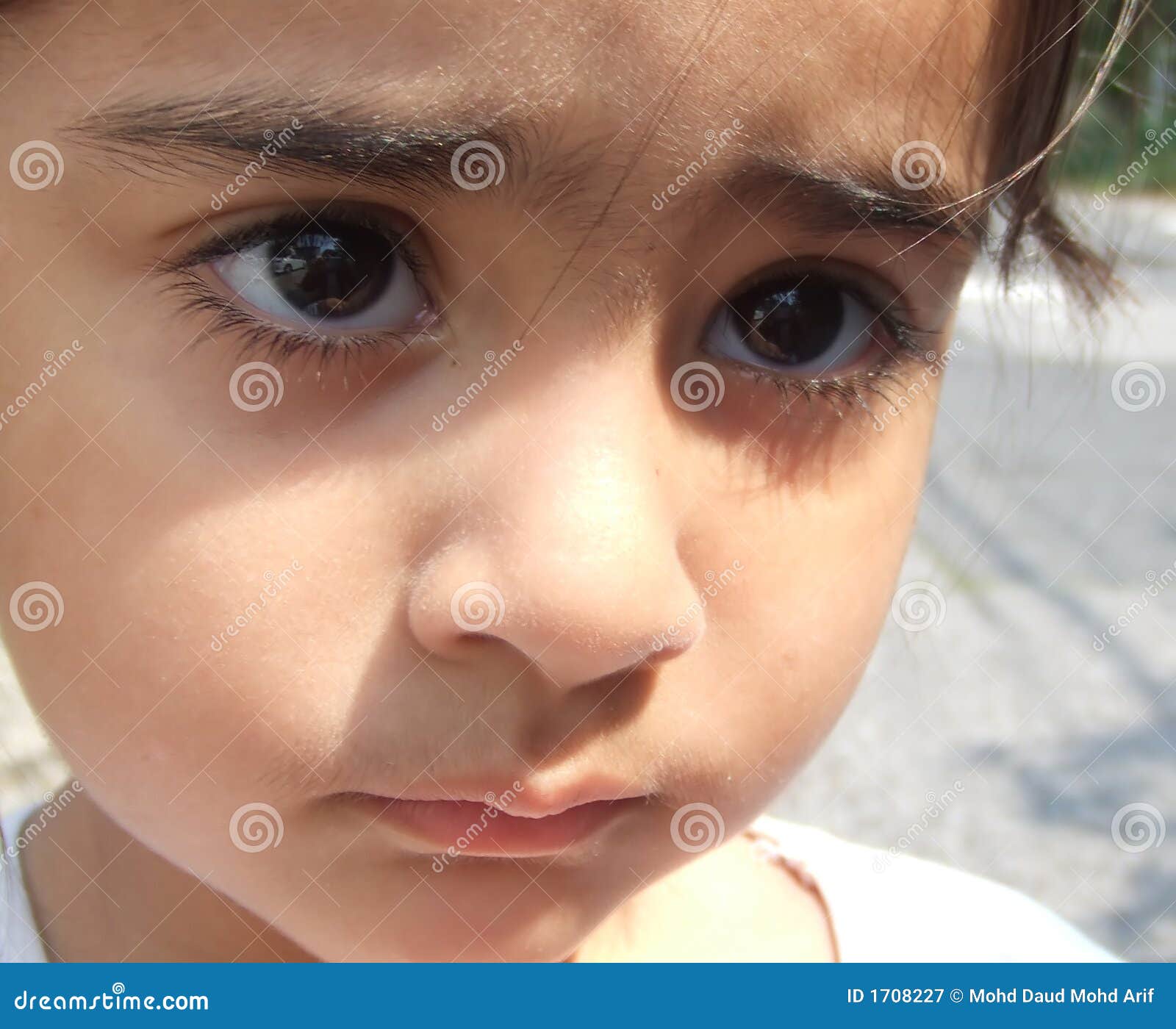 Premium Photo  Child girl sad profile face close up with hands on cheek.