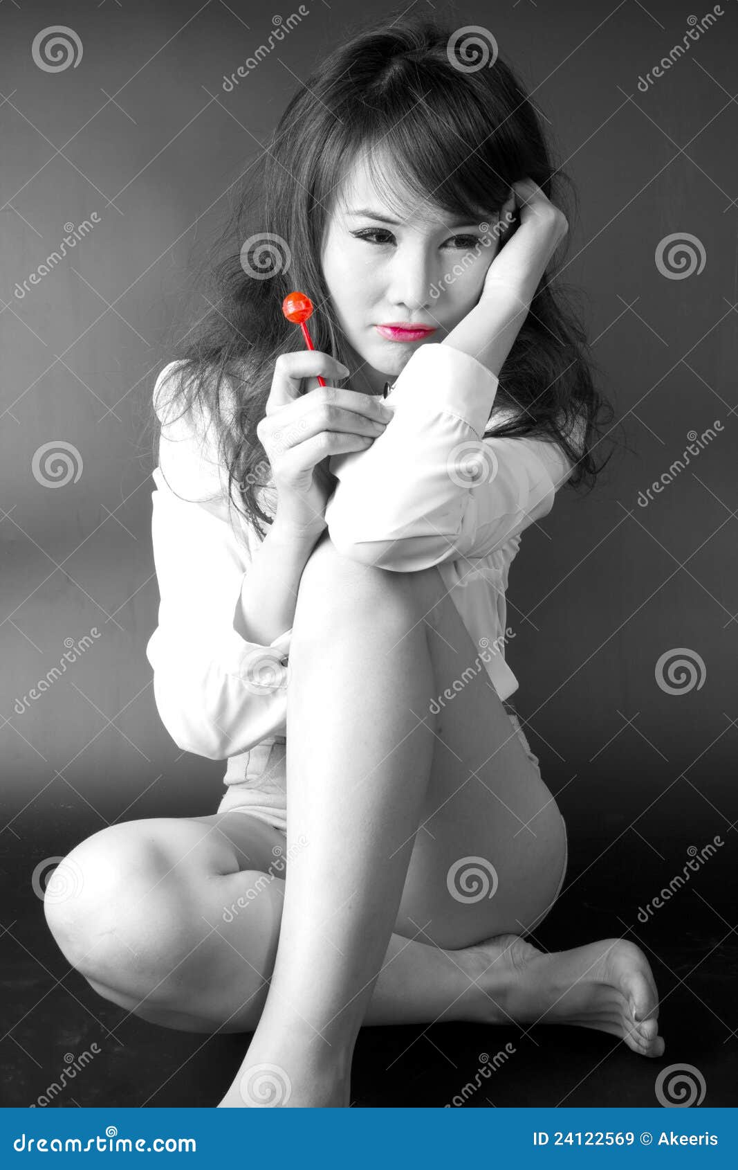 Image of Sad girl facing downwards on a wooden table top-UT112727-Picxy