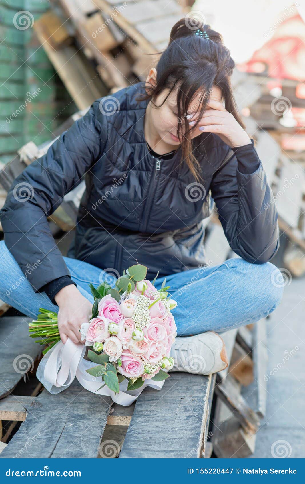 Sad Girl Sits on a Bench and Holds a Wedding Bouquet. Girl Crying ...