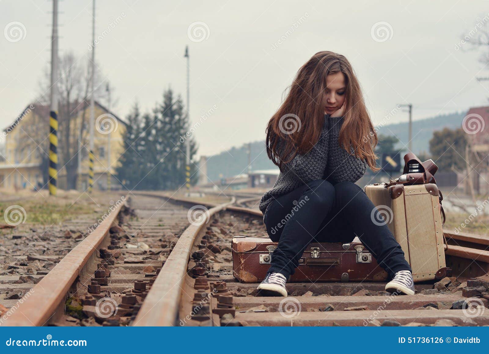 stock photo sad girl sitting old suitcase rails retro image51736126