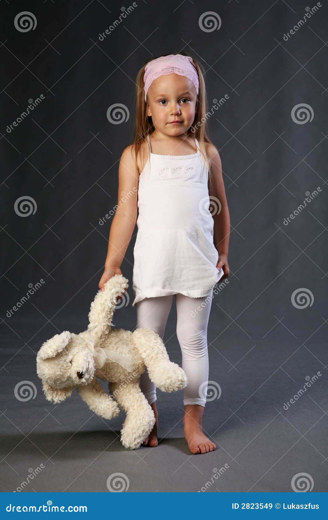 little girl holding a teddy bear