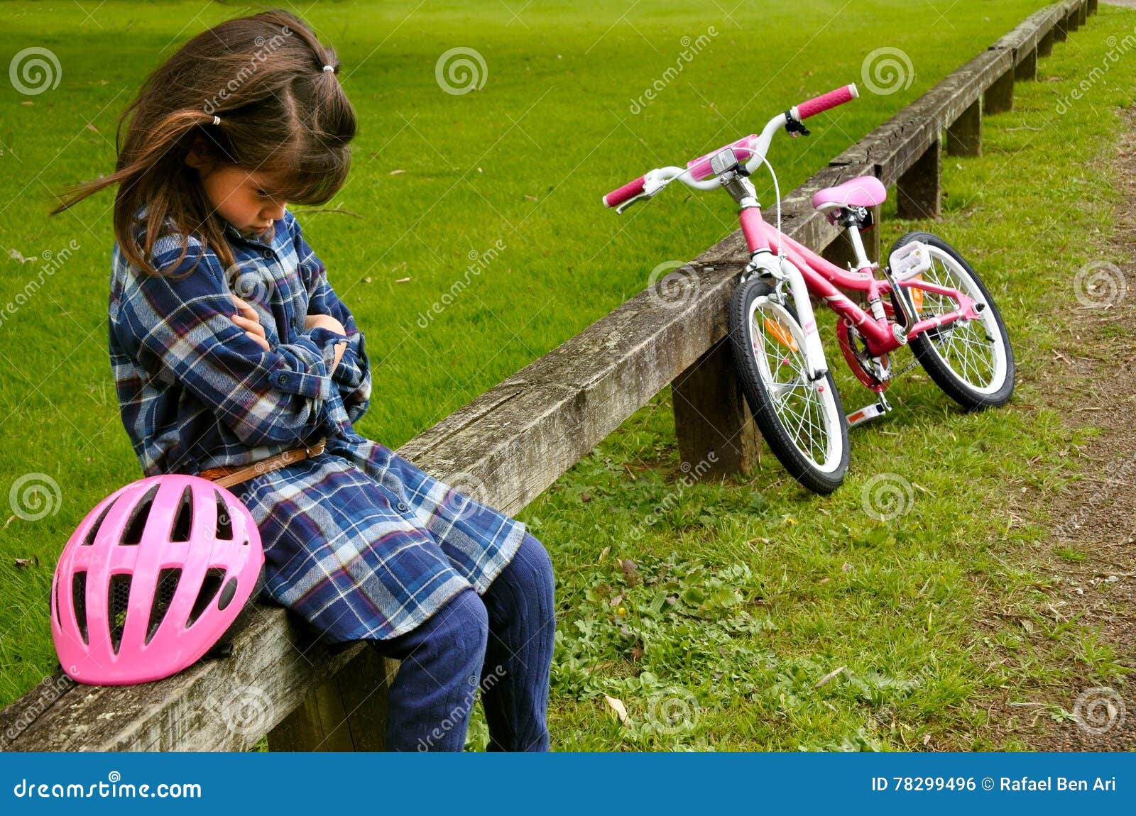 sad little girl do not know how to ride a bike