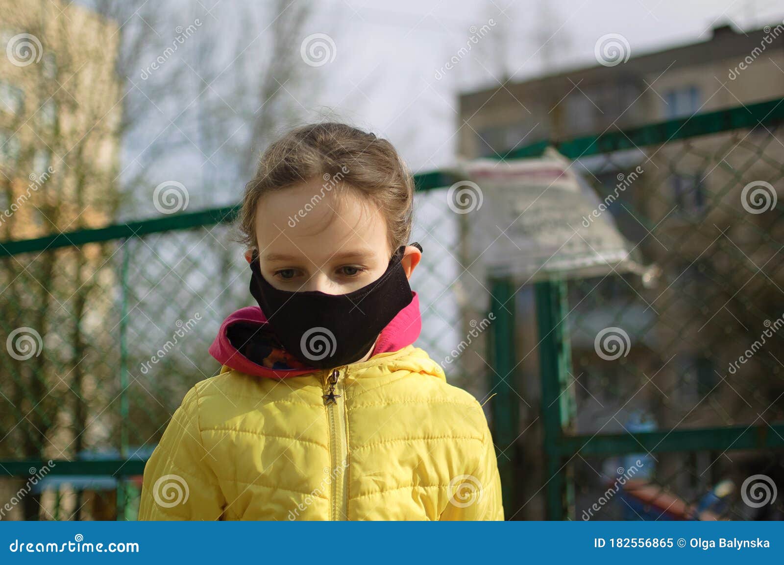 Download Sad Little Girl In Face Mask In Yellow Jacket Standing Near Closed Playground Outdoor Kids Play Area Locked Because Of Stock Image Image Of Face Park 182556865 PSD Mockup Templates