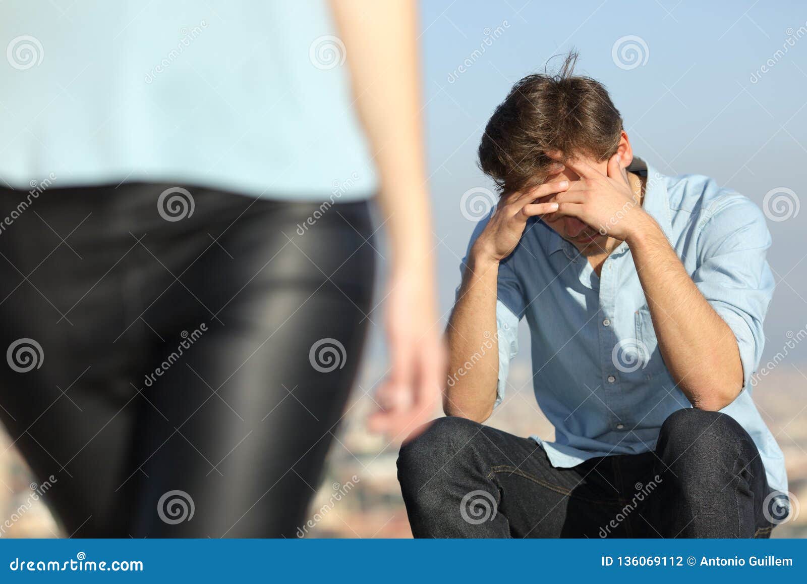 sad man complaining outdoors after break up