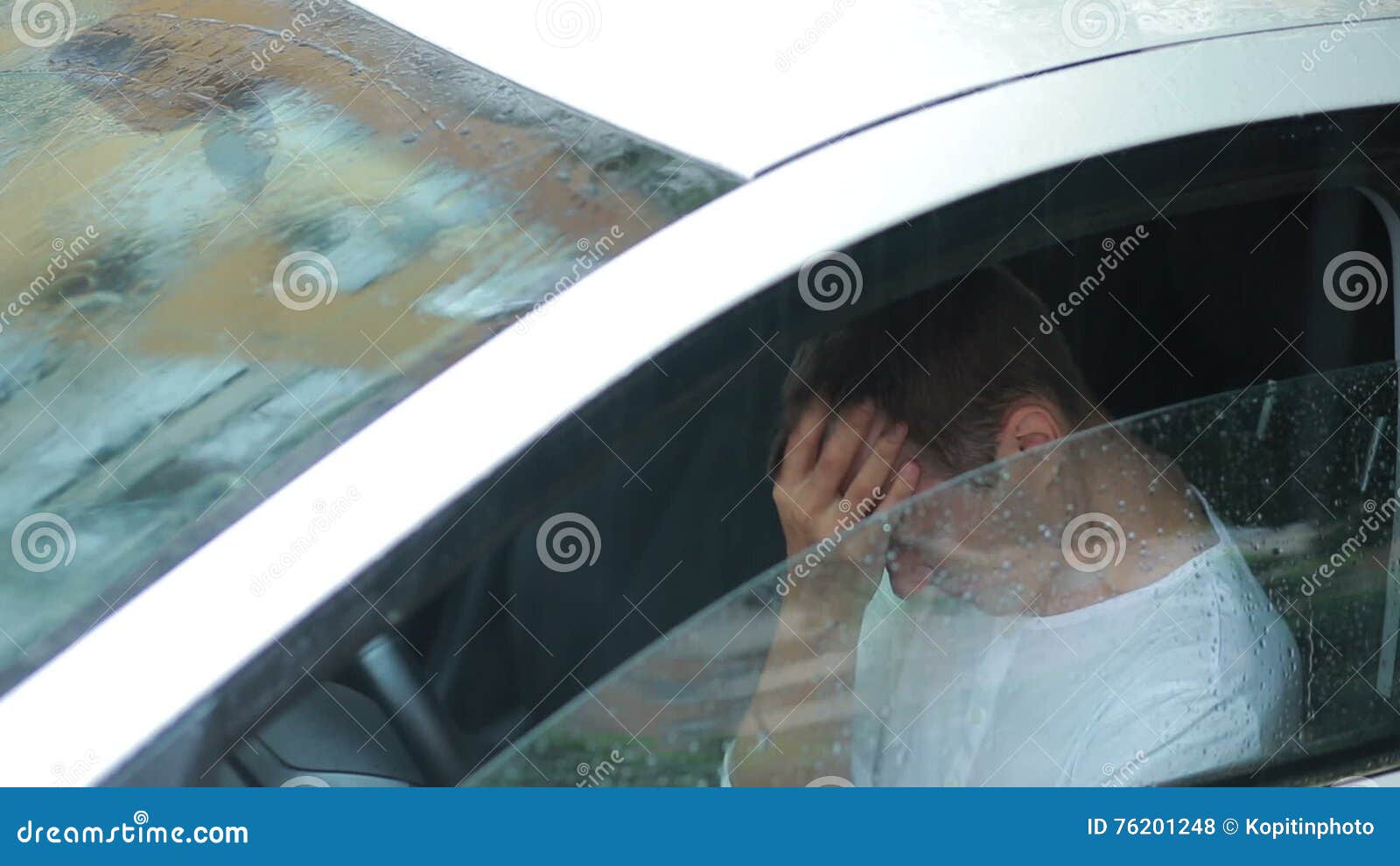 guy crying in rain